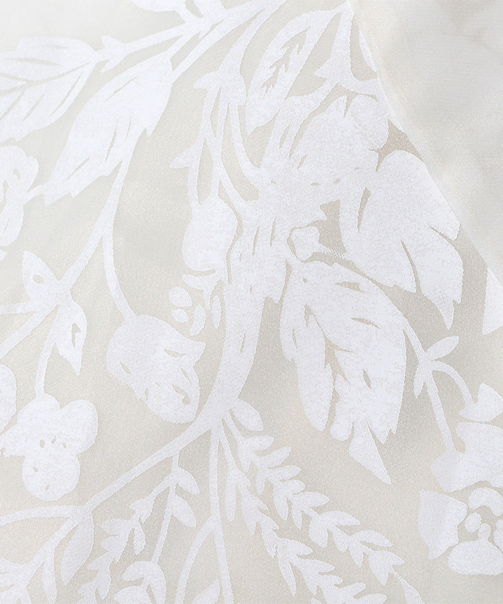 White floral pattern on a beige background
