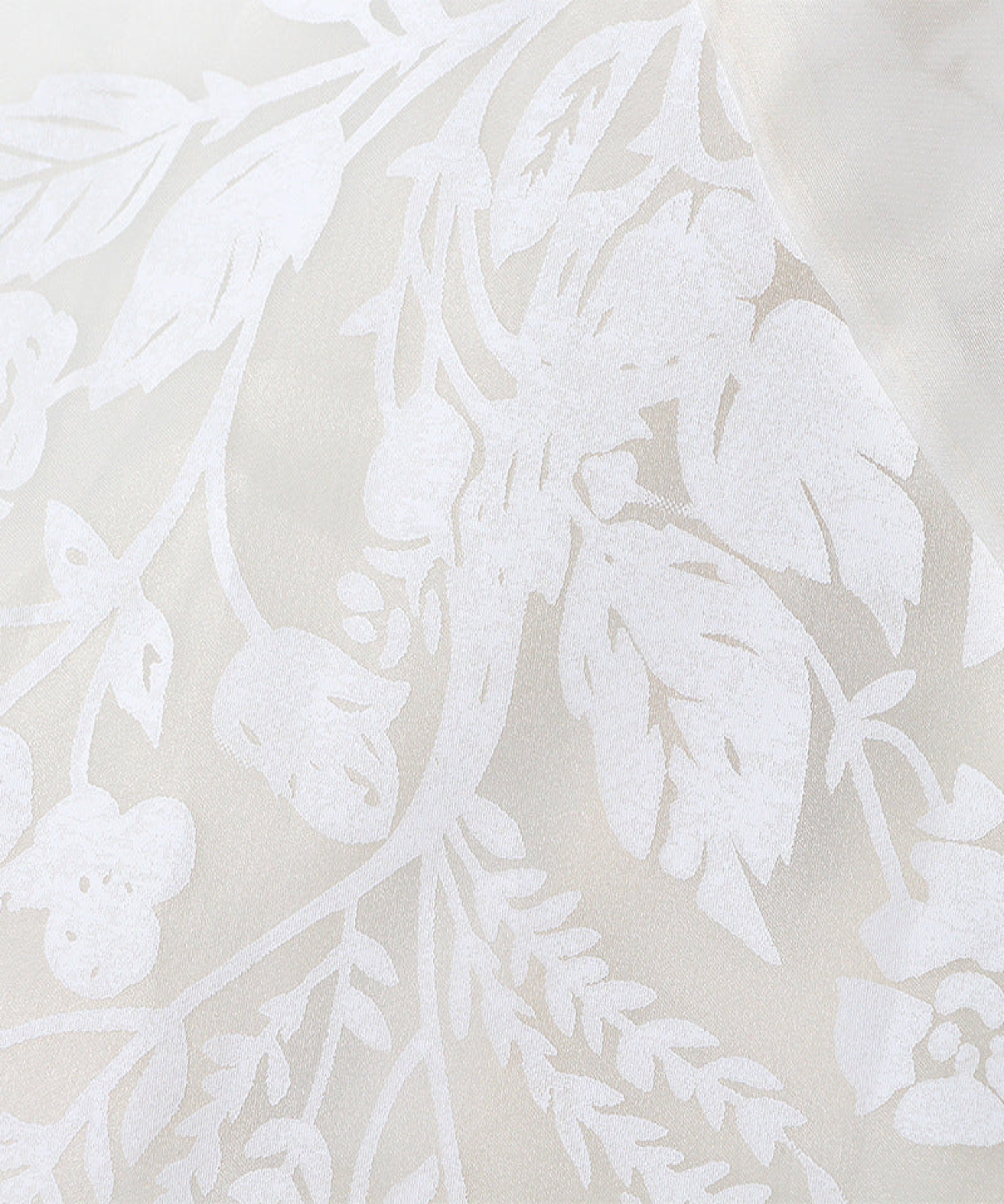 White floral pattern on a beige background