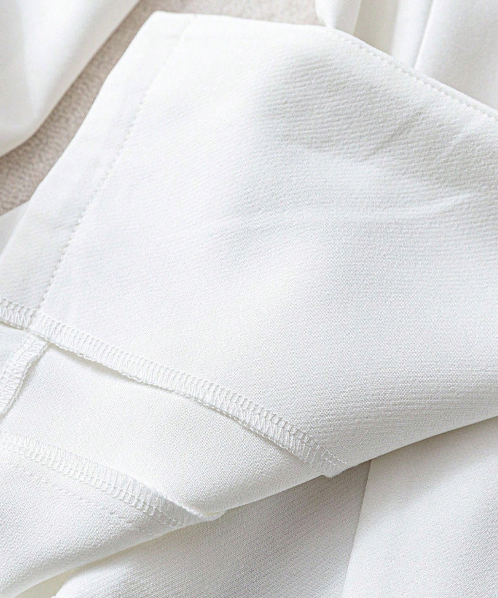 Close-up of white fabric with a textured pattern