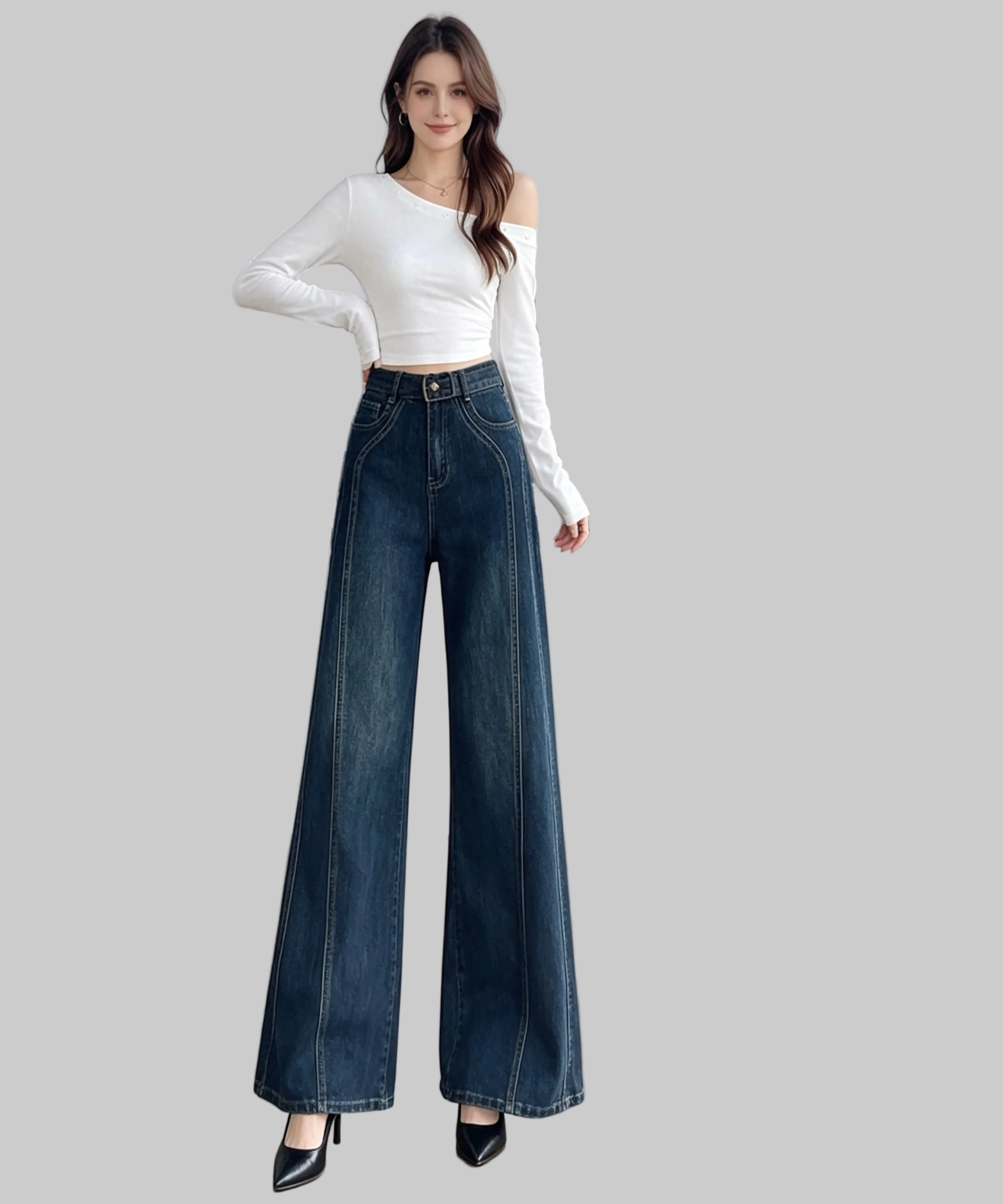 Woman wearing a white top and blue jeans standing on a white  background