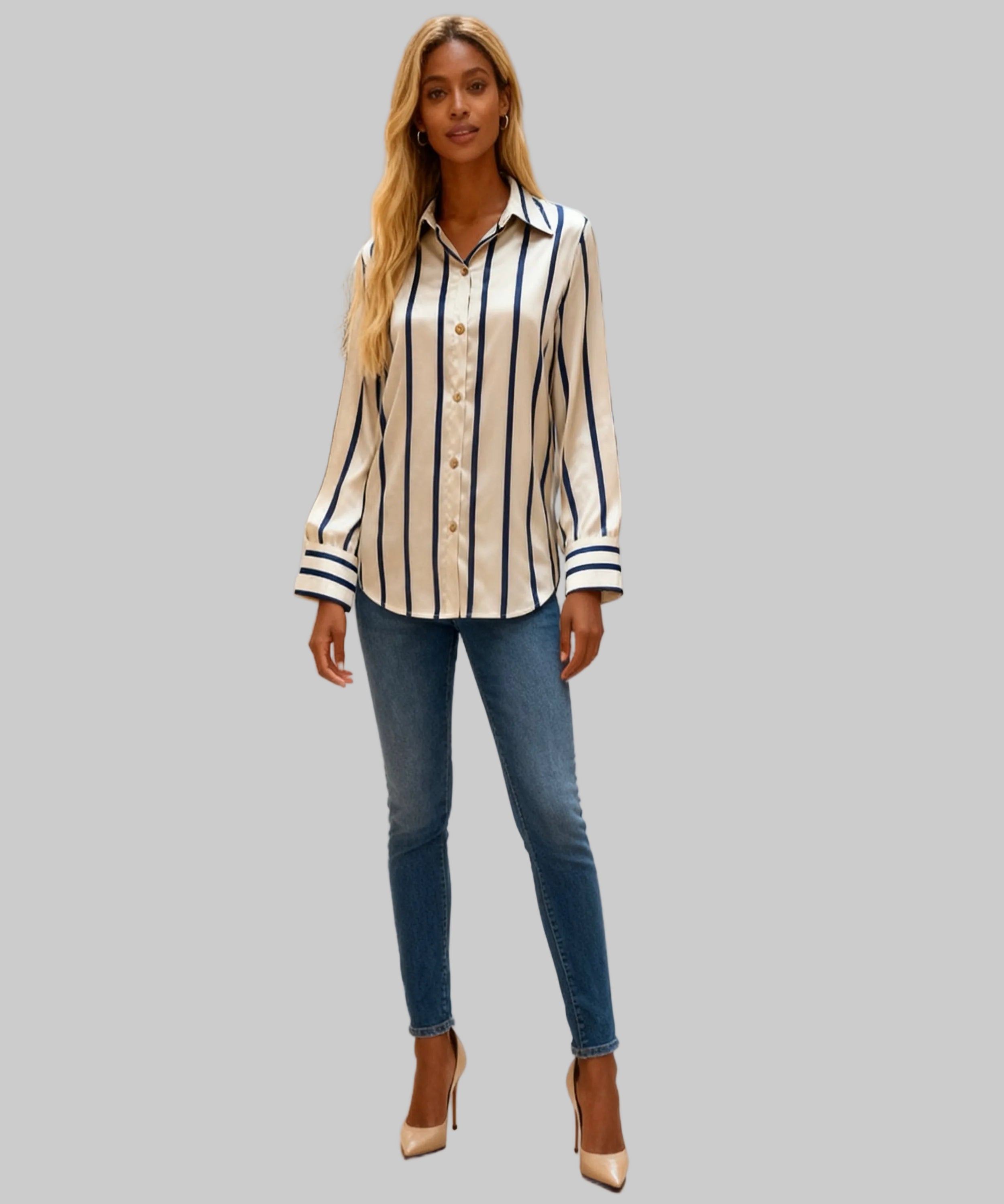 Woman wearing a striped shirt and jeans in a white background
