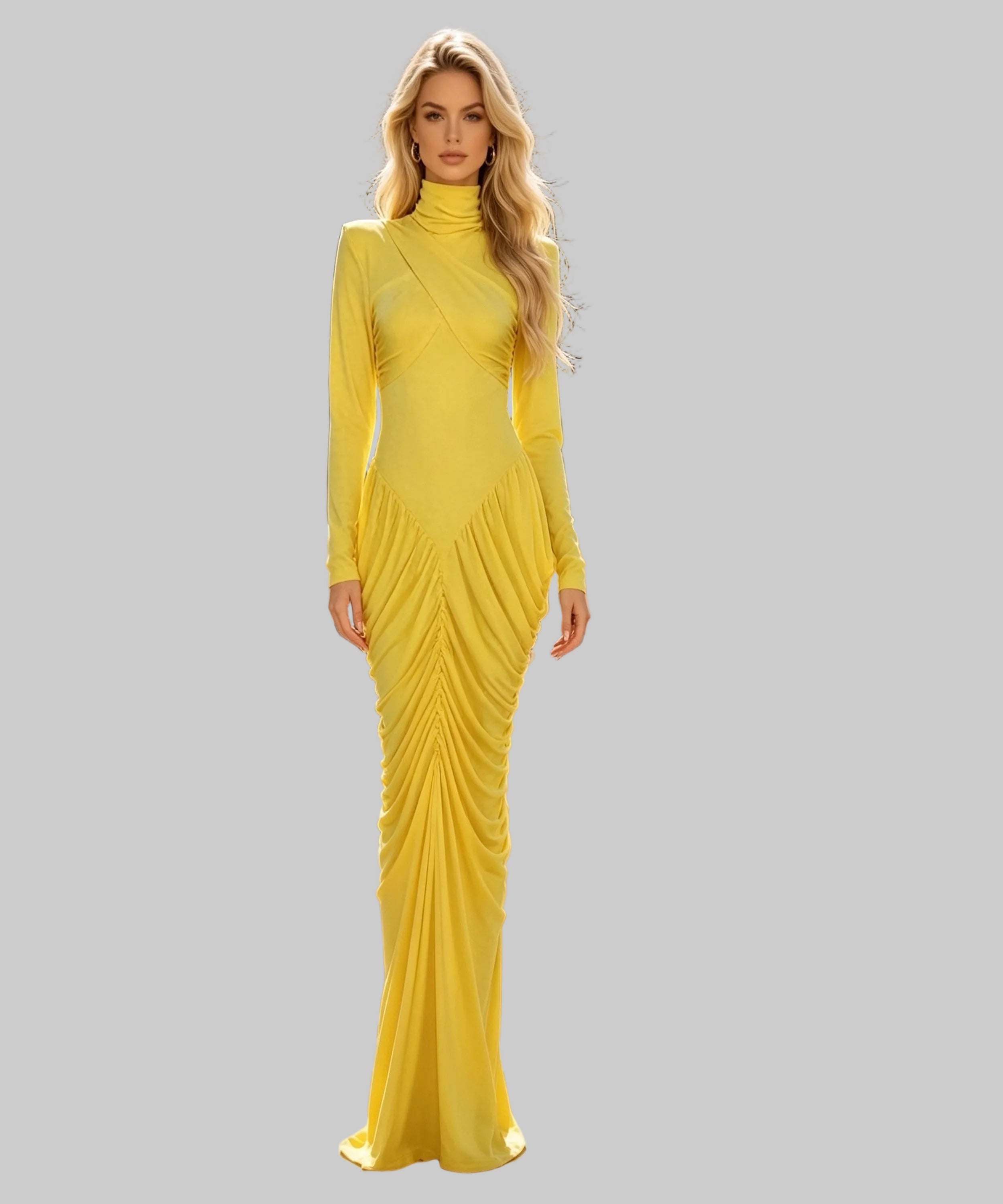 A woman stands on a white background wearing a bright yellow long-sleeve high-neck maxi dress with gathered draping details down the front. 