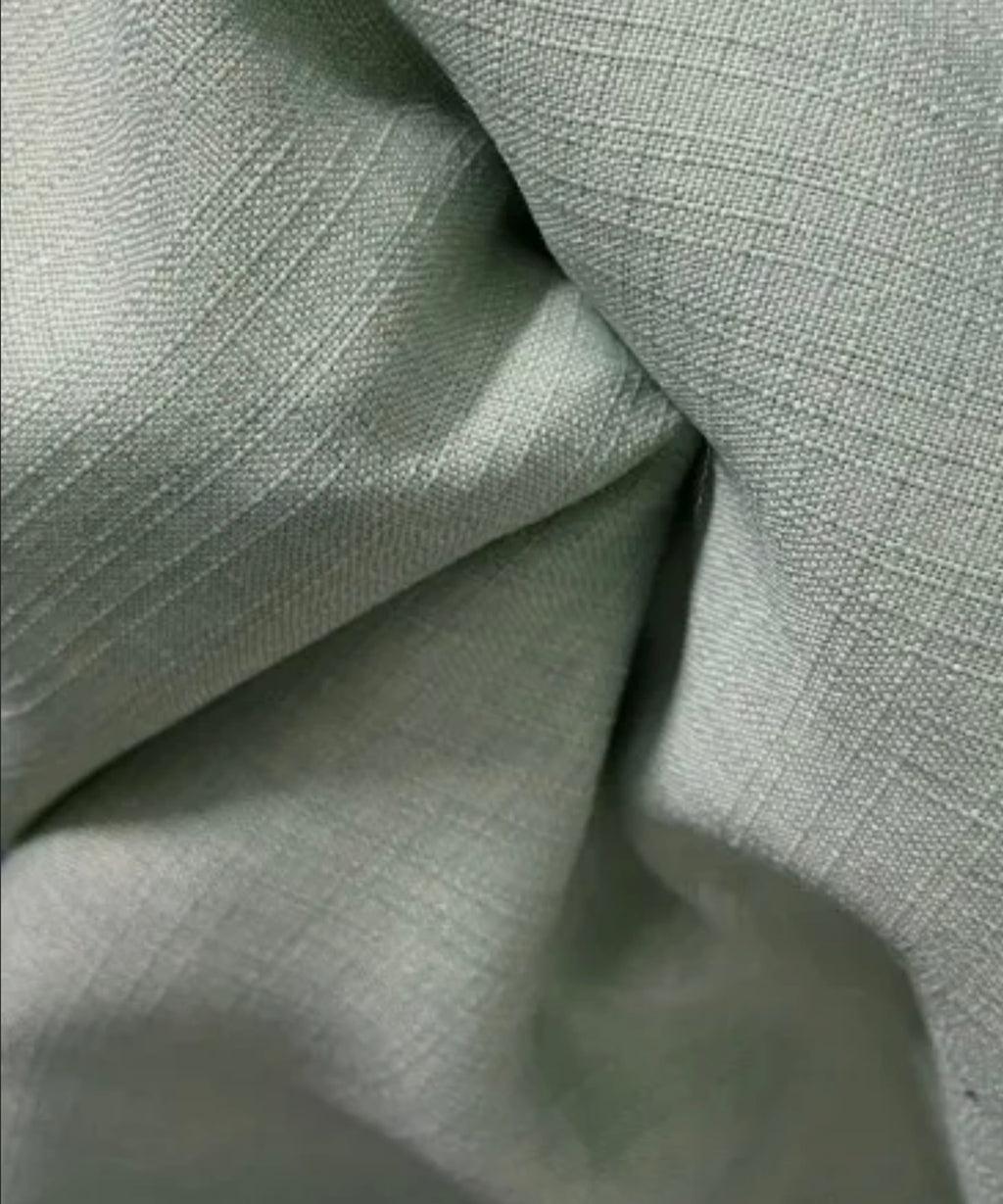 Close-up of textured light gray fabric