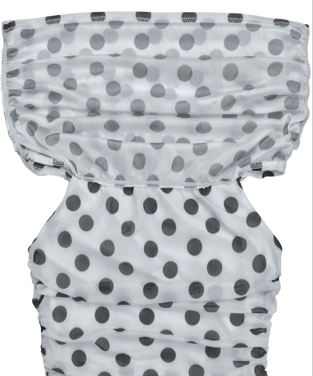White ruffled fabric accessory with a black polka dot pattern, shown against a plain white background.