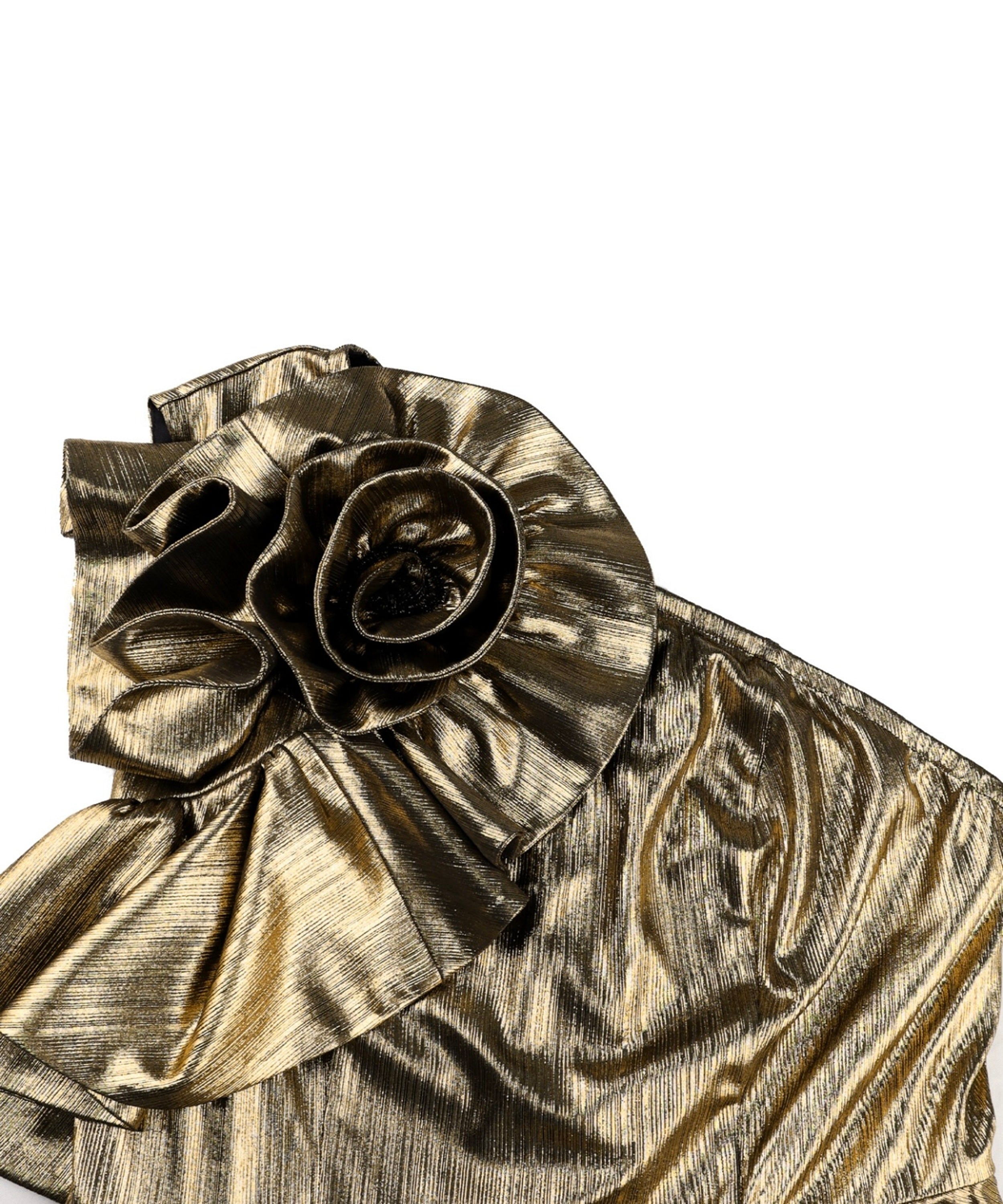Close-up of a metallic gold ruffled garment detail with a large fabric flower applique on a plain white background.