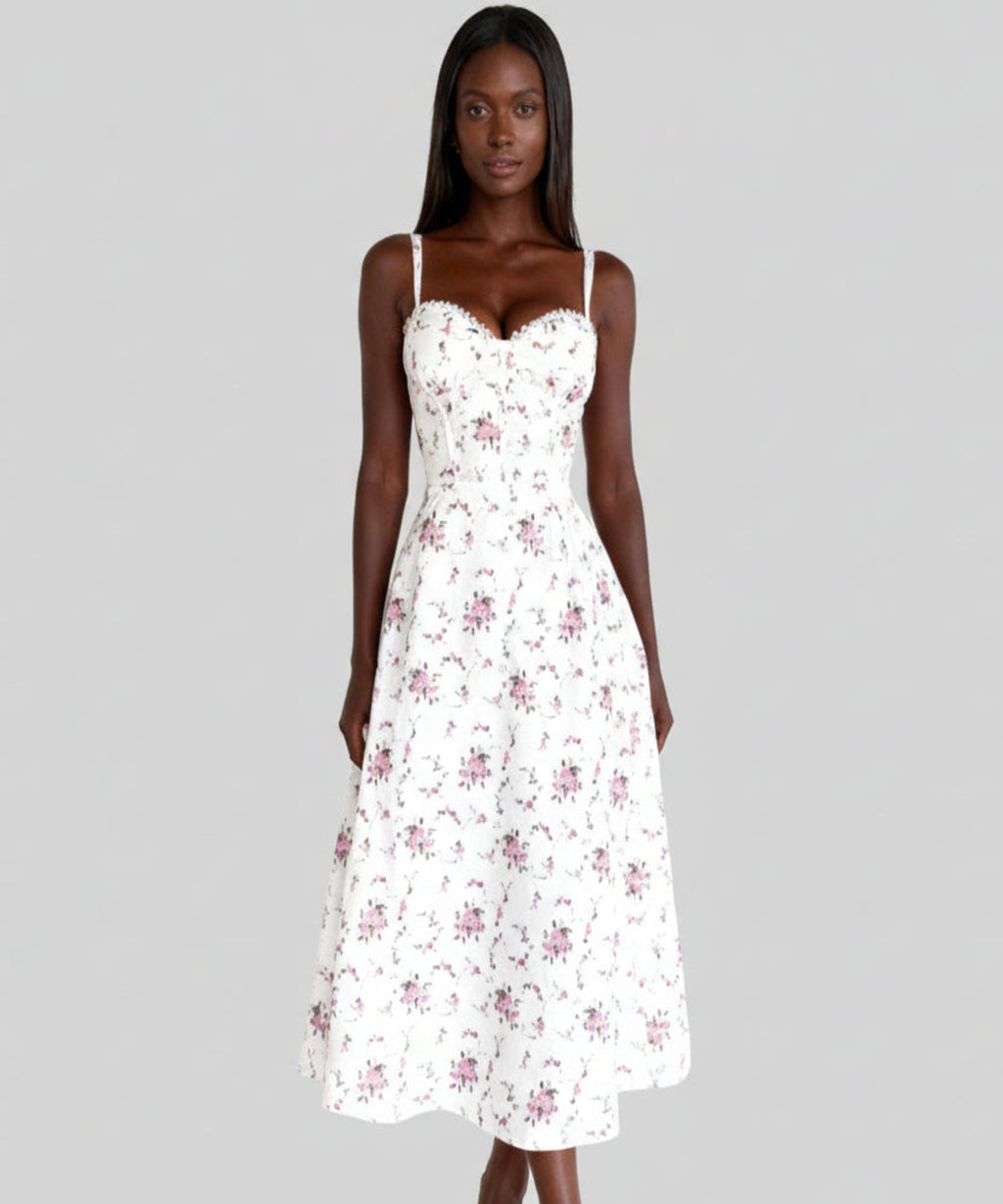 Woman wearing a white floral dress on a white background