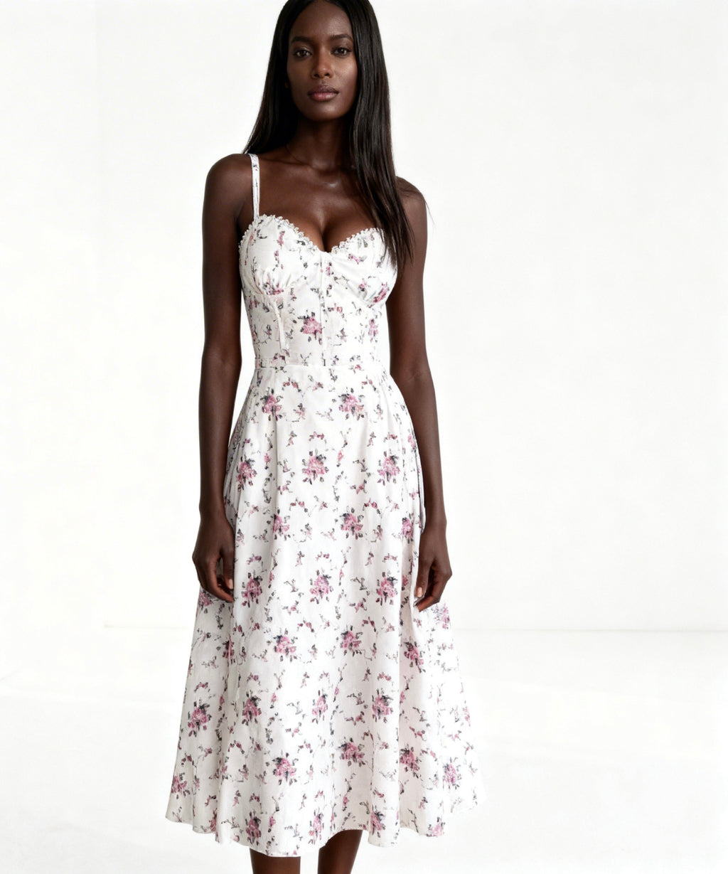 Woman wearing a white floral dress on a white background