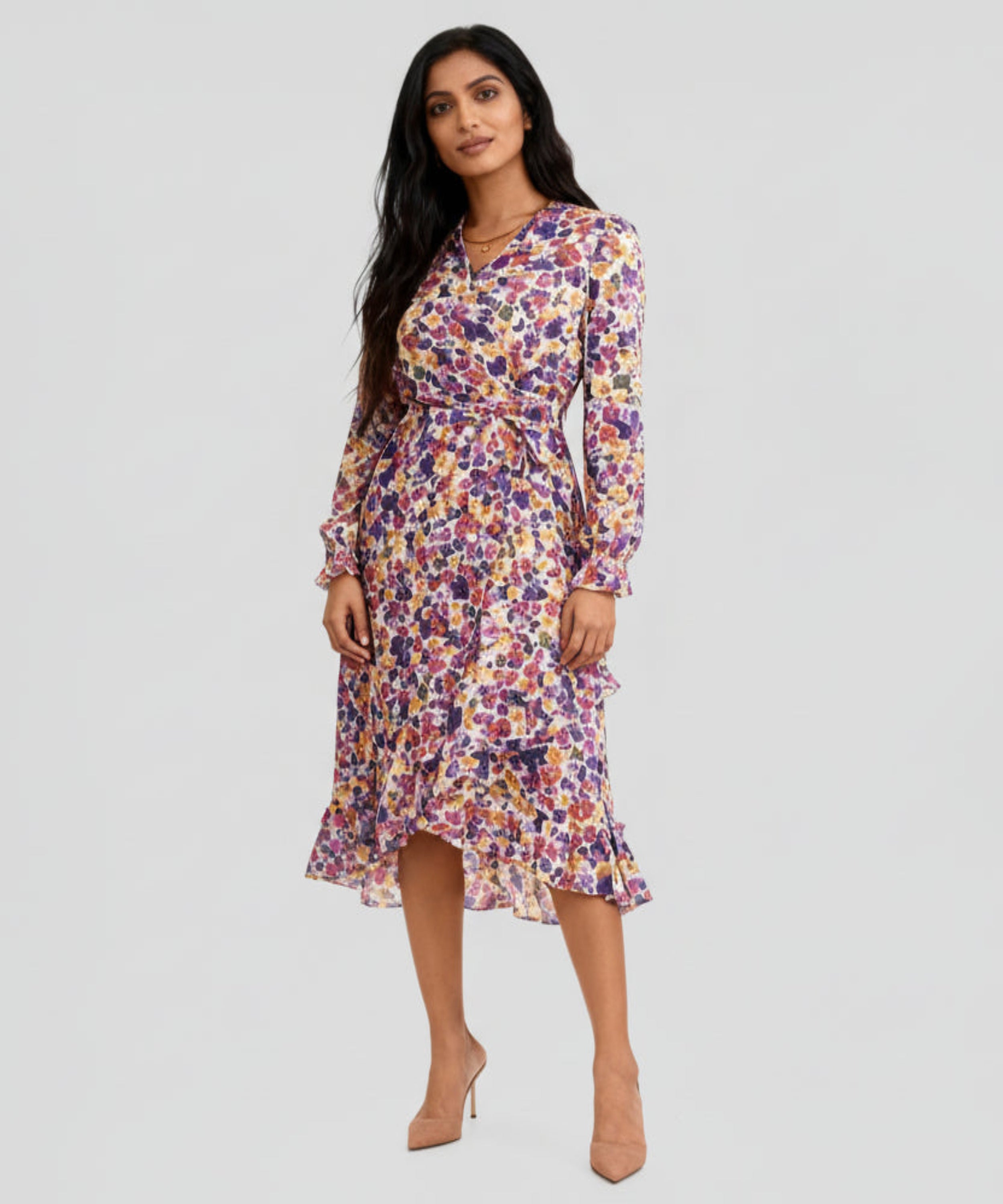 Woman wearing a floral dress on a white background