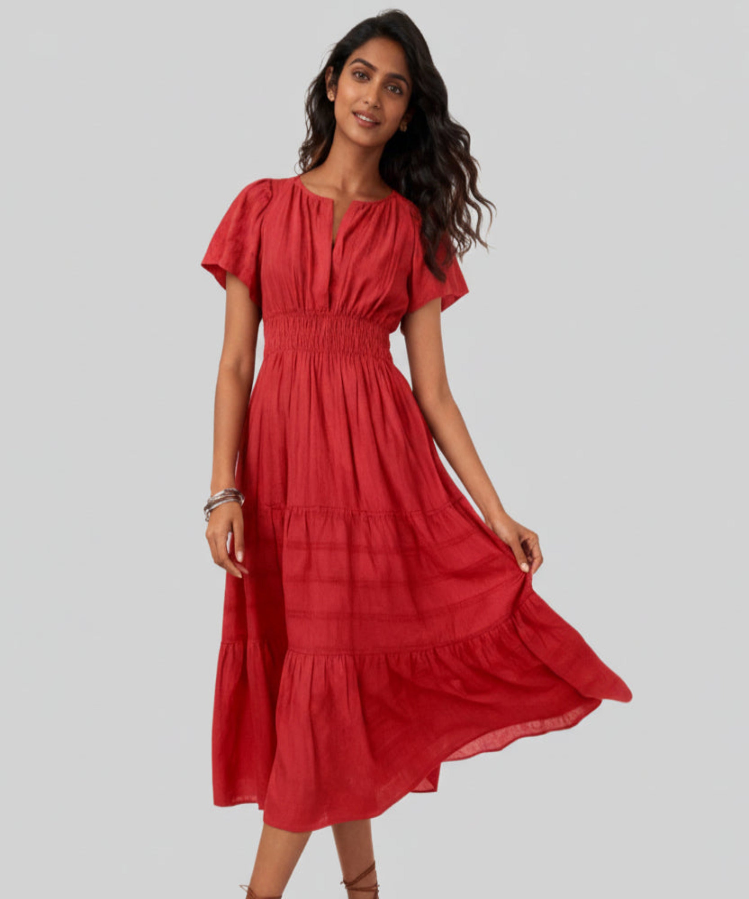 Woman wearing a red dress on a white background