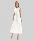 Woman wearing a white sleeveless dress on a white background