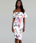 Woman wearing a floral off-shoulder dress on a white background