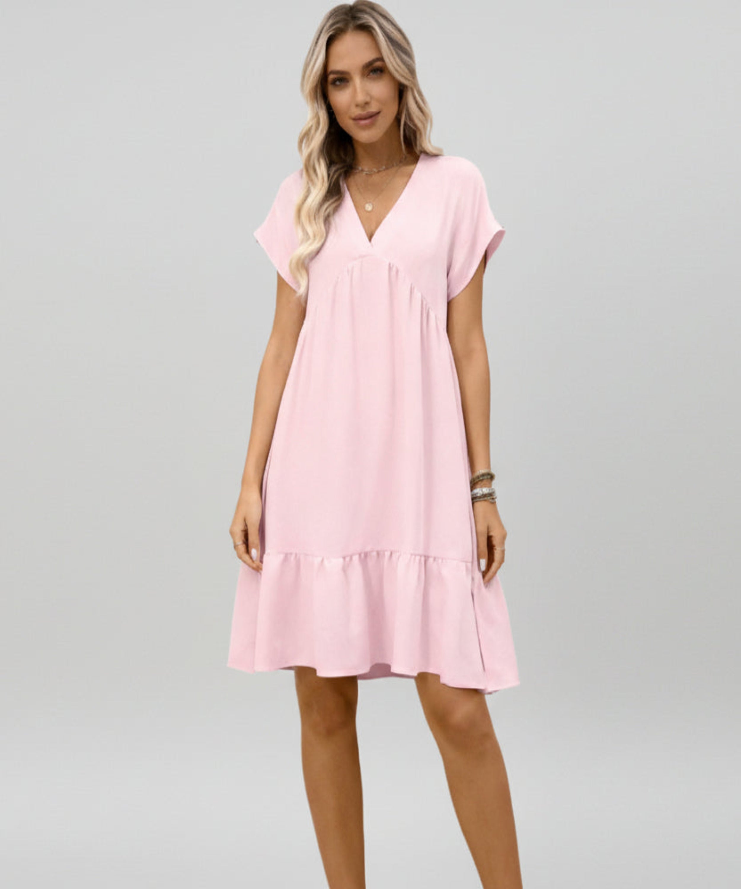 Woman wearing a pink dress on a white background