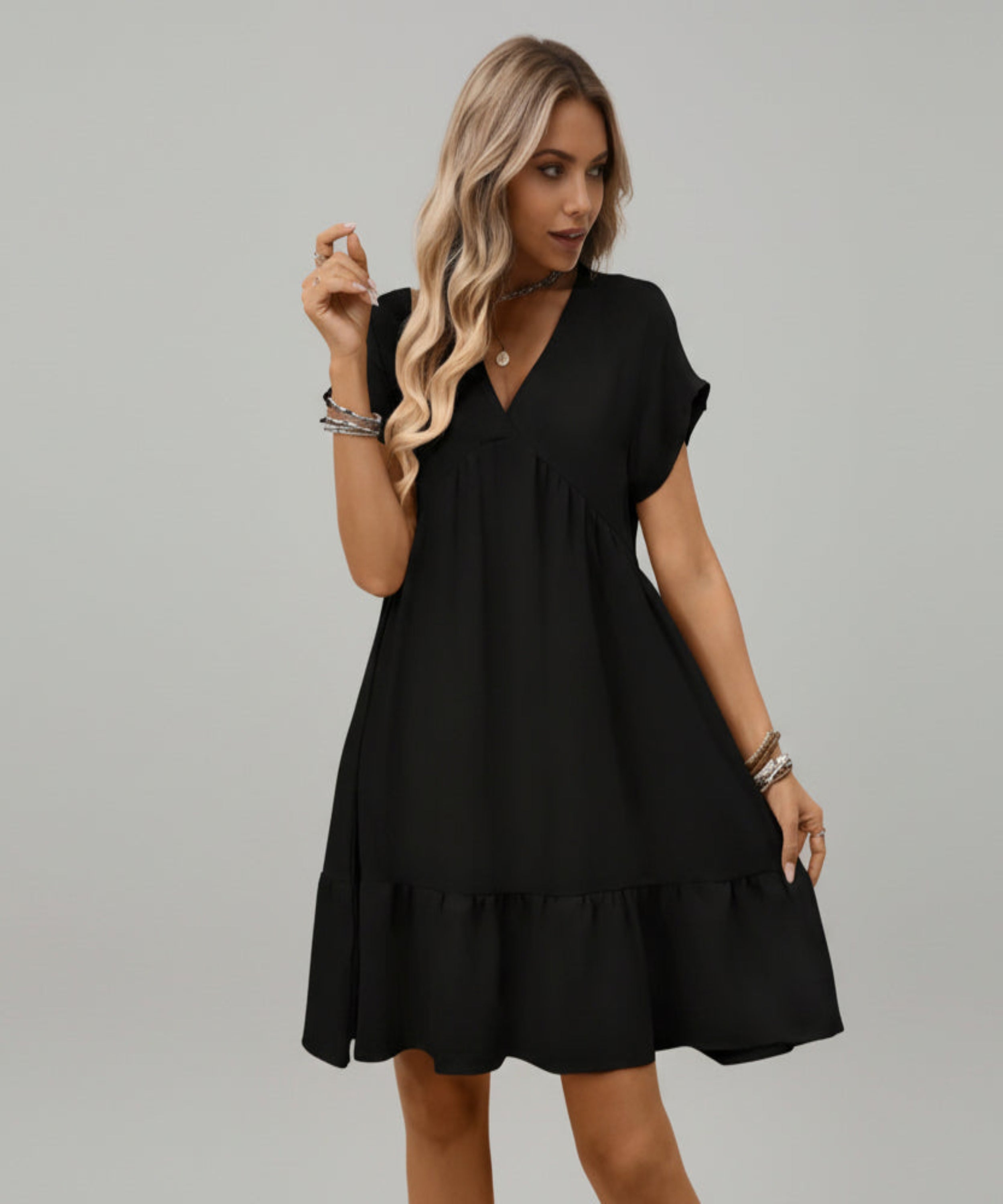 Woman wearing a black dress on a white background
