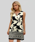 Woman wearing a black and white floral dress on a white background
