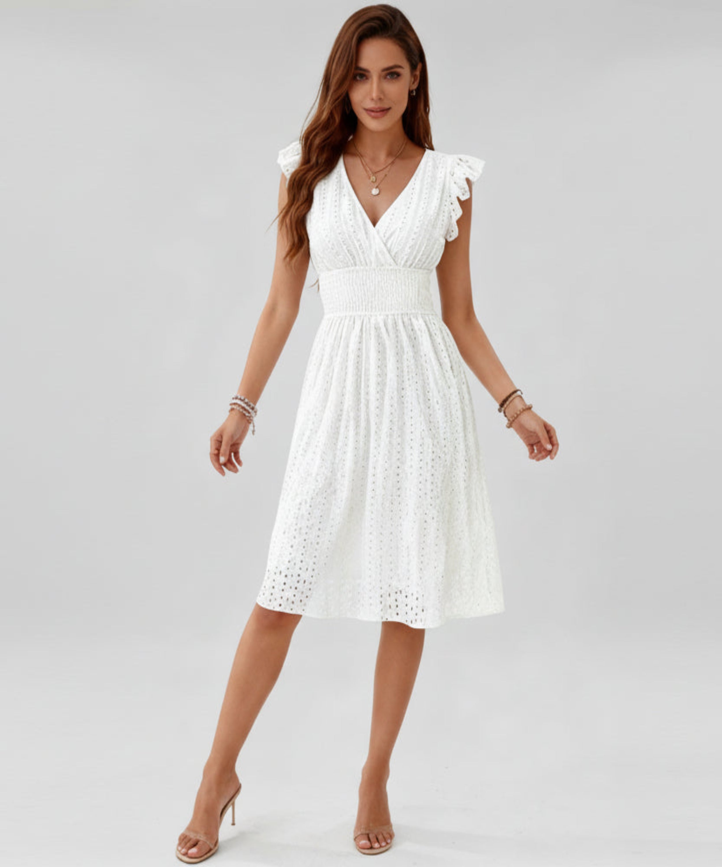 Woman wearing a white dress on a white background