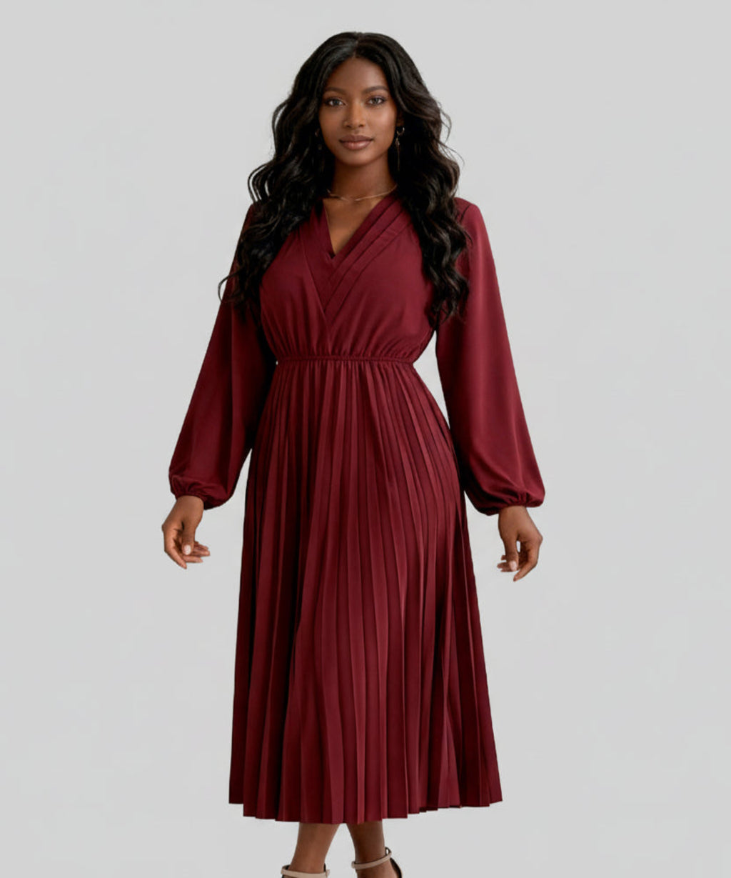 Woman wearing a burgundy dress on a white background