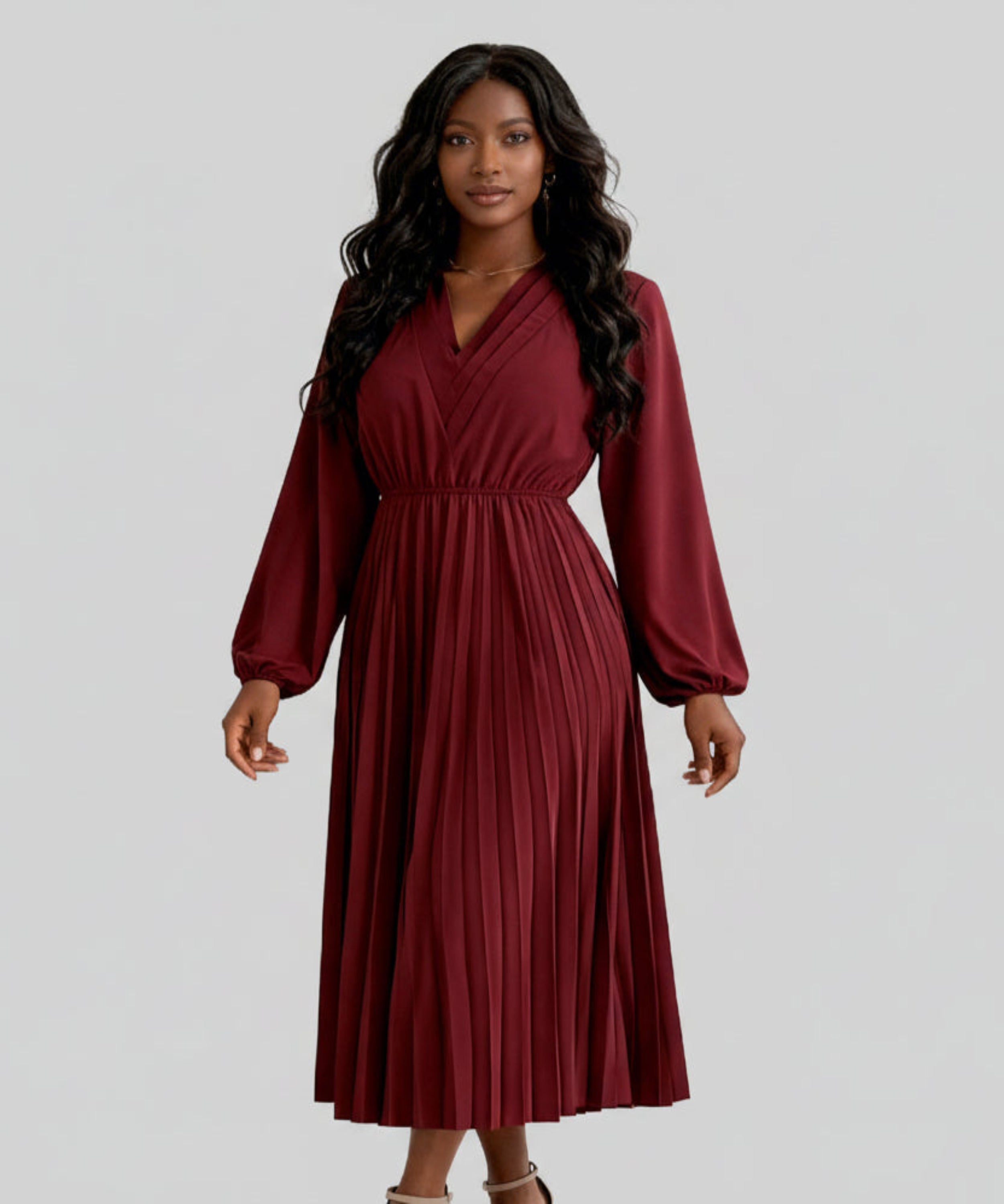 Woman wearing a burgundy dress on a white background
