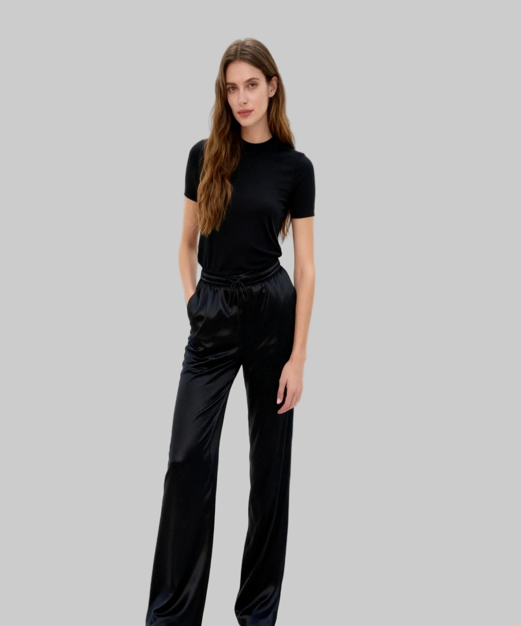 Woman wearing a black outfit on a white background