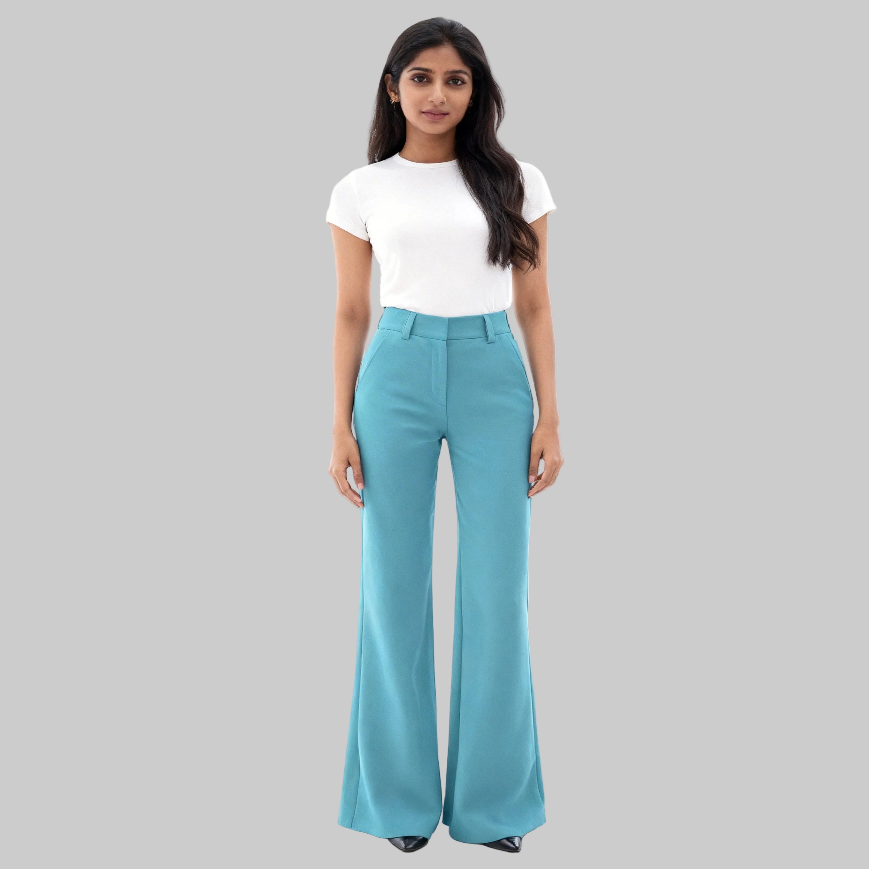 Asian women dressed on light blue trousers sits on a white background