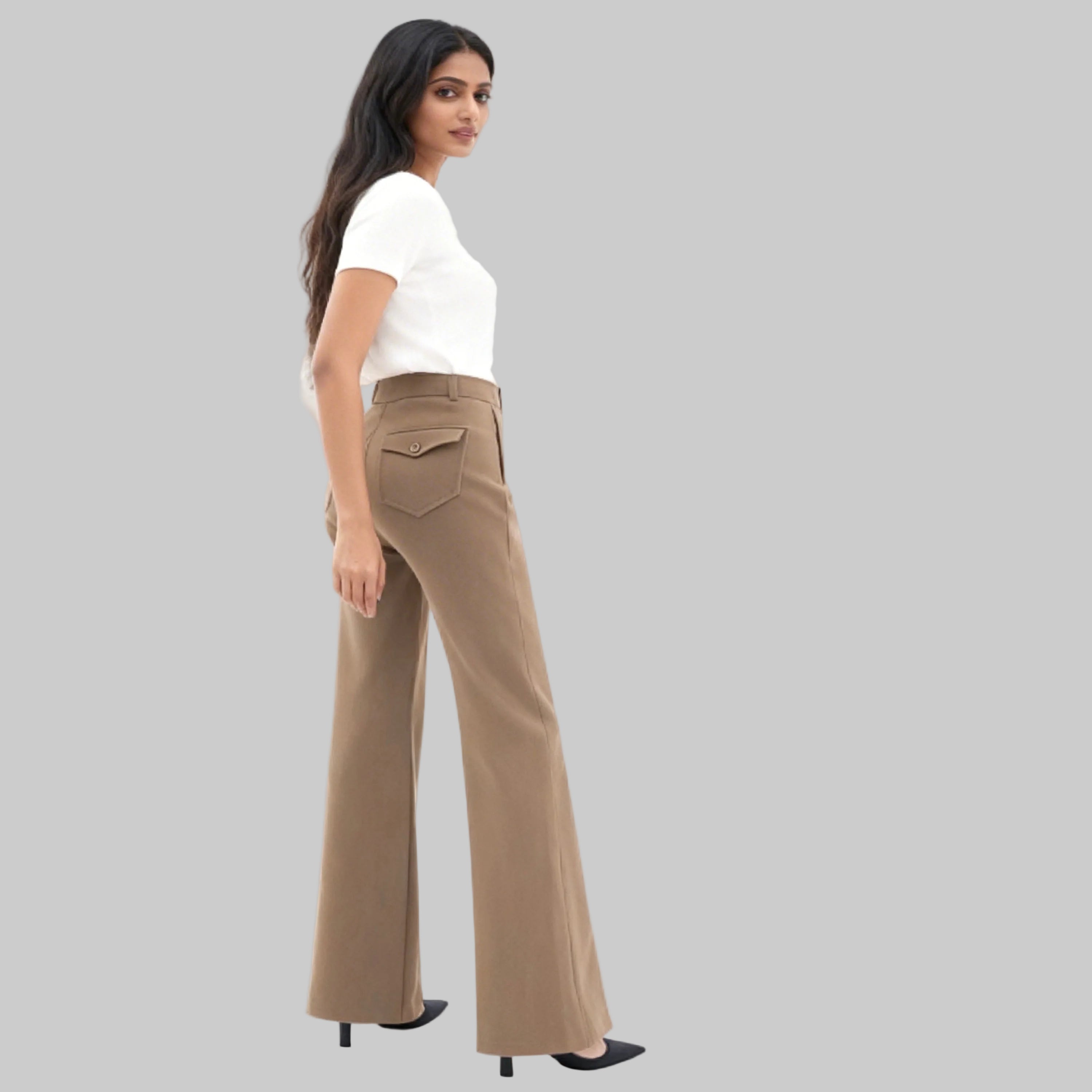 Asian women with beige trousers sits in one side on a white background