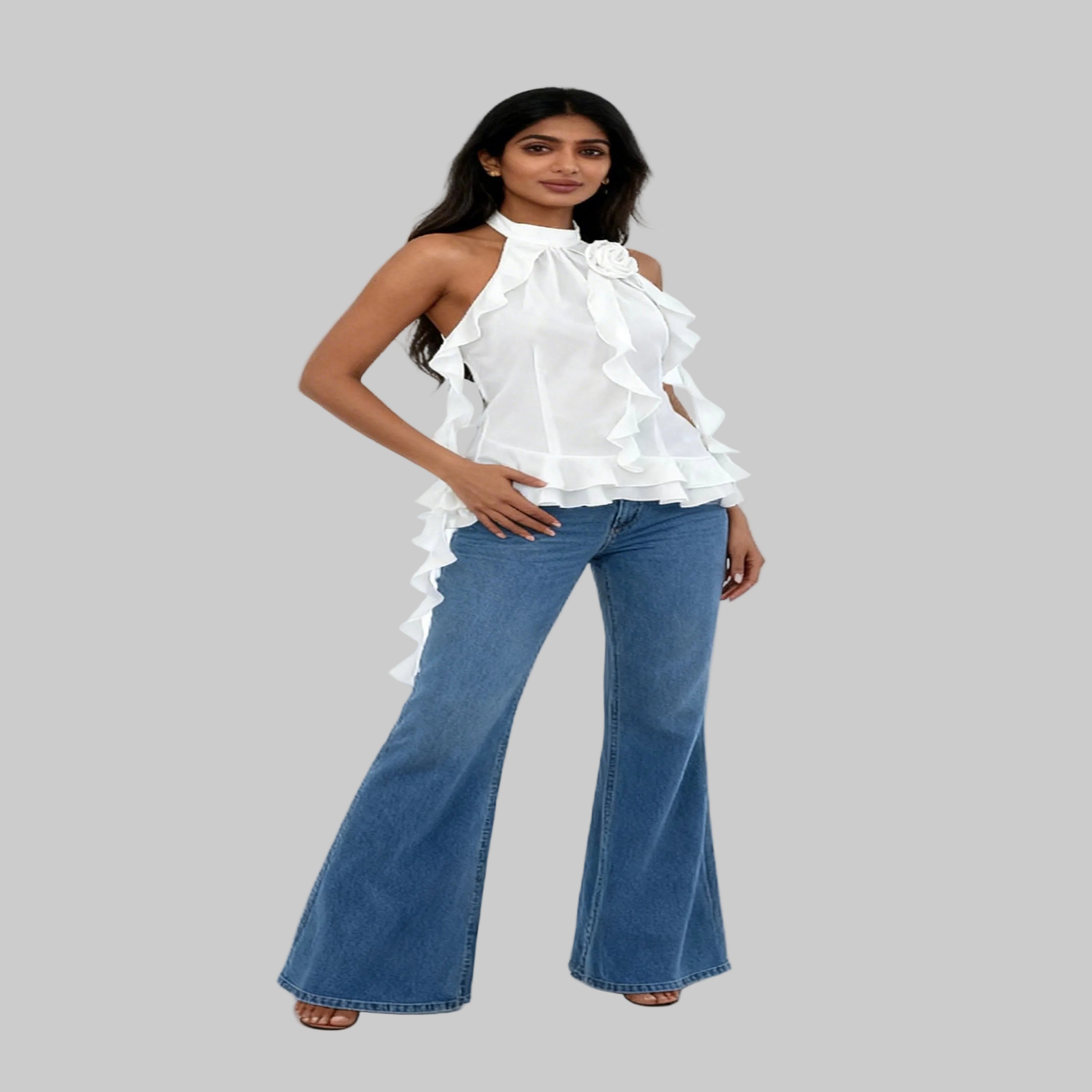 Woman wearing a white top and blue jeans on a white background