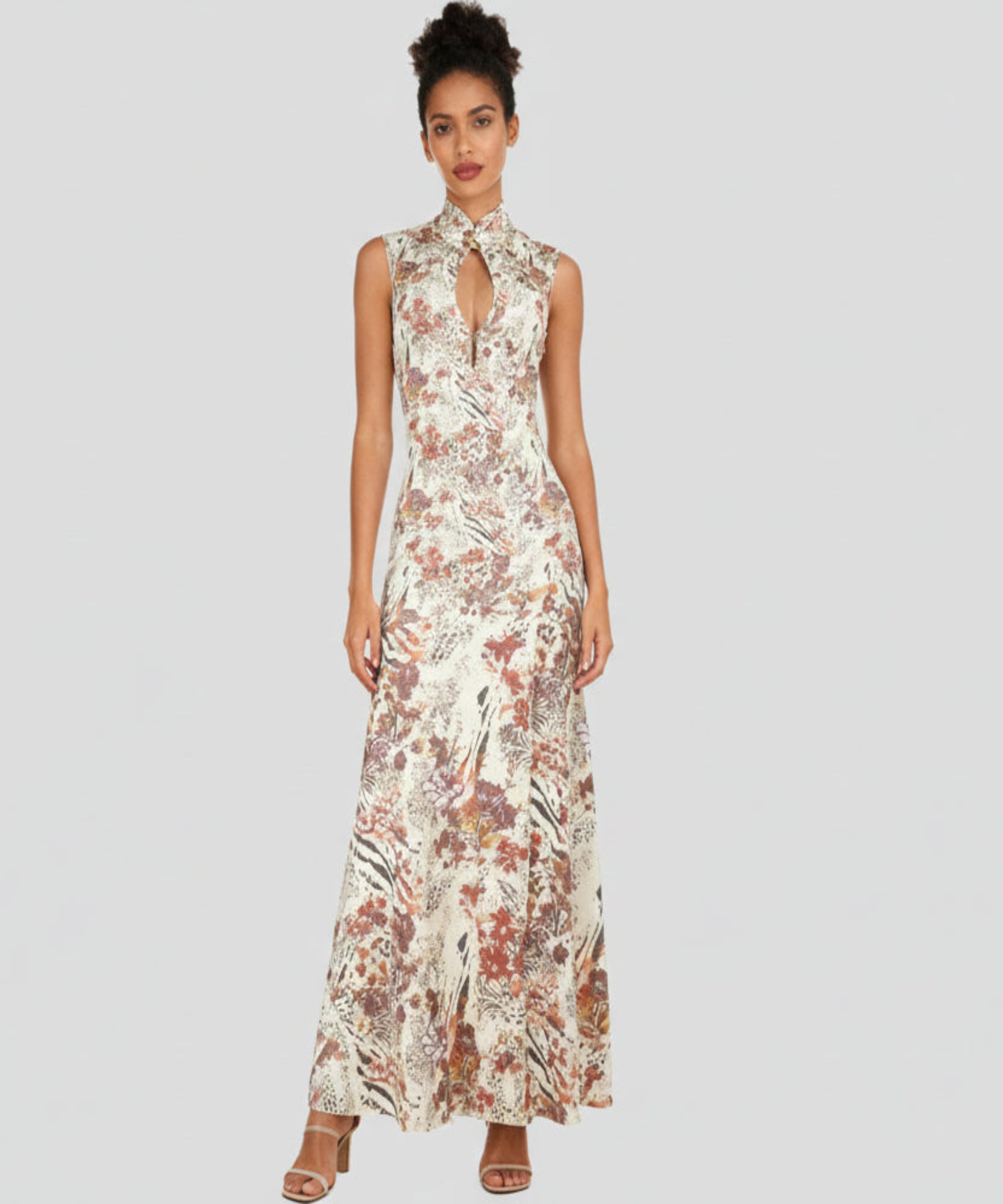 Coloured Girl with floral printed dress sitting in the light grey background