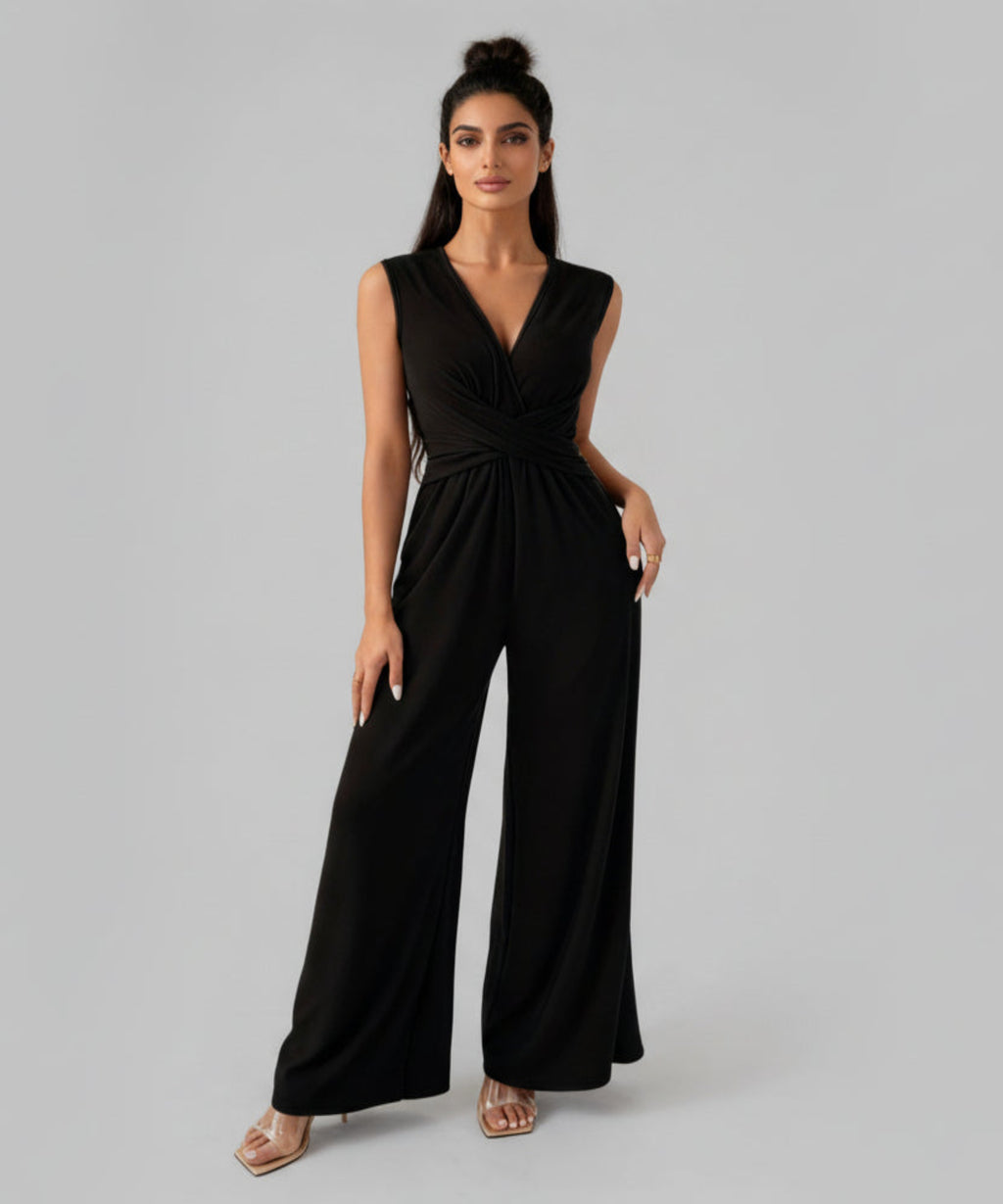 Woman wearing a black jumpsuit on a white background