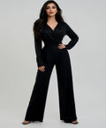 Woman wearing a black jumpsuit on a white background