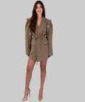 Woman wearing a beige trench coat on a white background