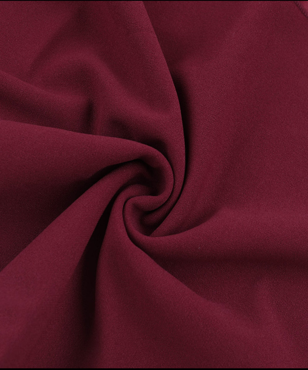 Close-up of dark red fabric with folds