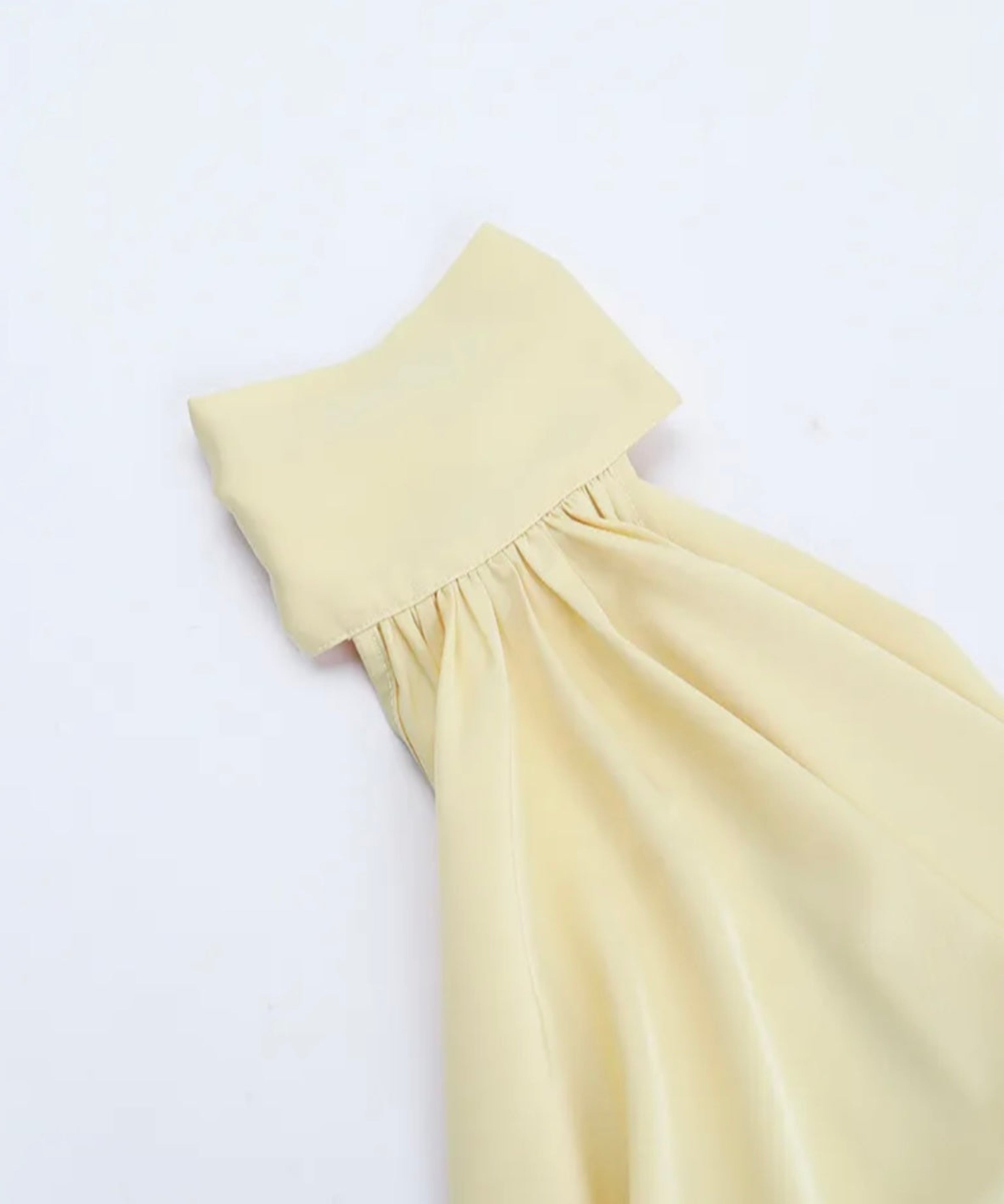 Light yellow dress on a white background