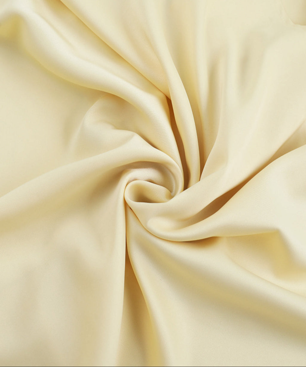 Close-up of beige fabric with folds