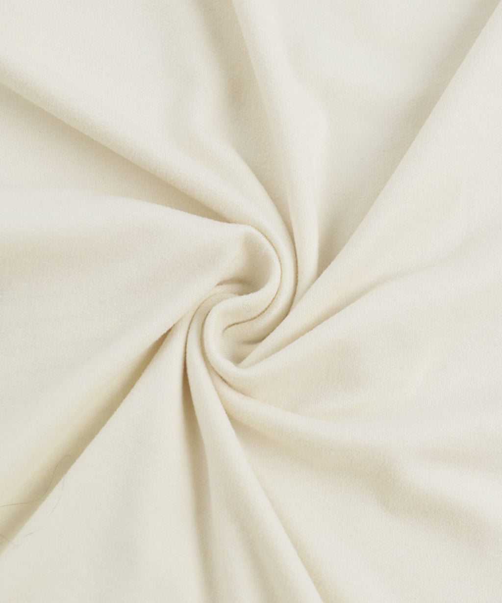 Close-up of beige fabric with folds