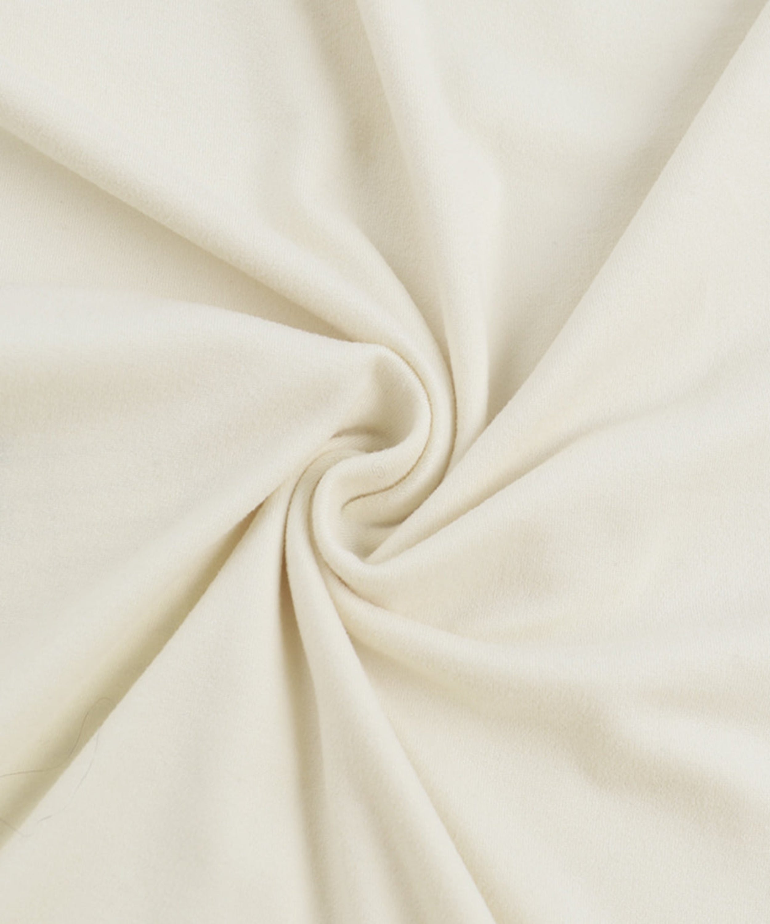 Close-up of beige fabric with folds