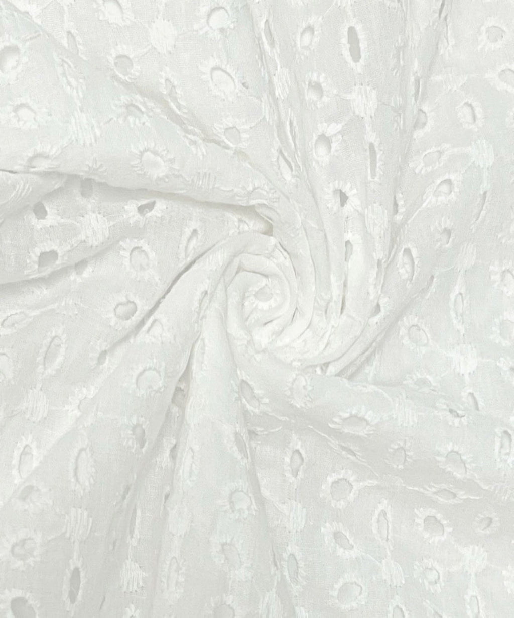 White fabric with subtle pattern on a white background