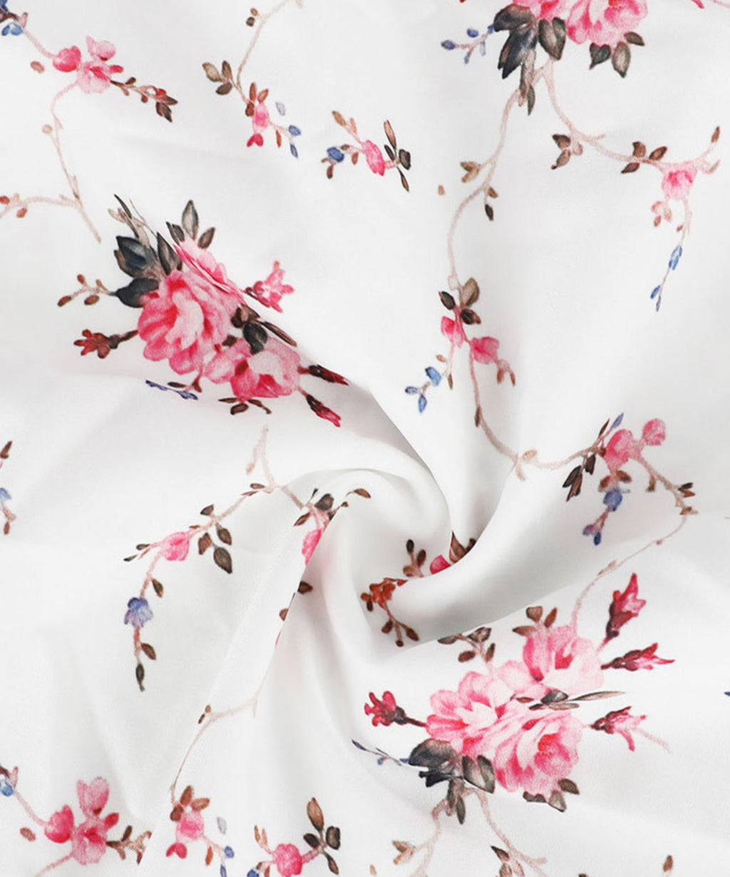 Floral fabric pattern with pink flowers and green leaves on a white background
