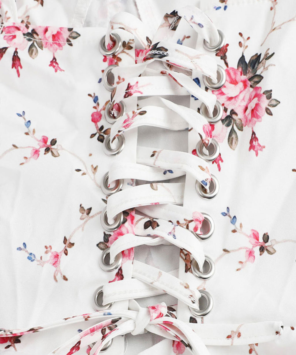 White floral-patterned shoelaces on a white background