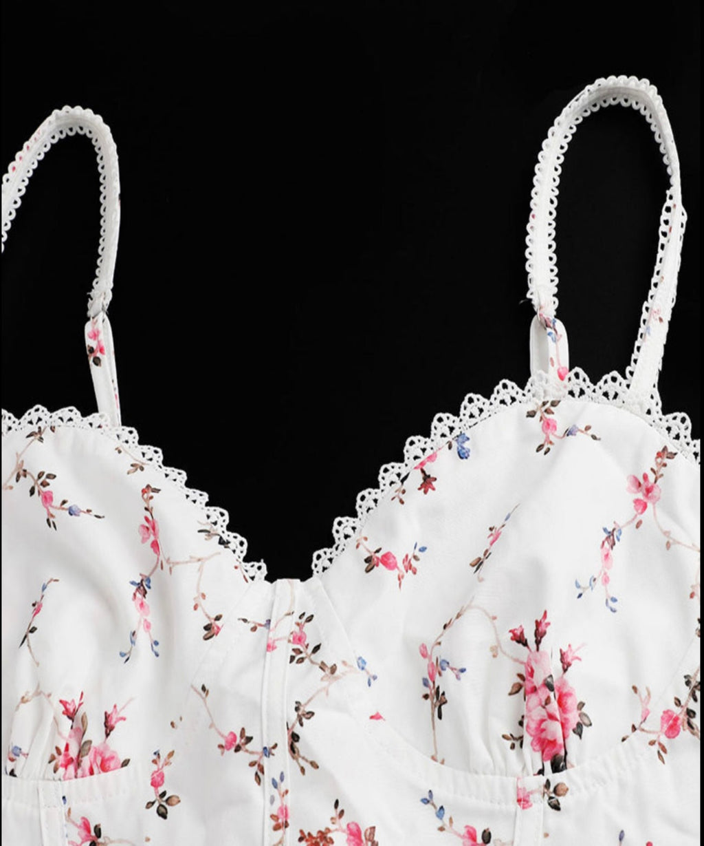 Floral-patterned bralette on a black background