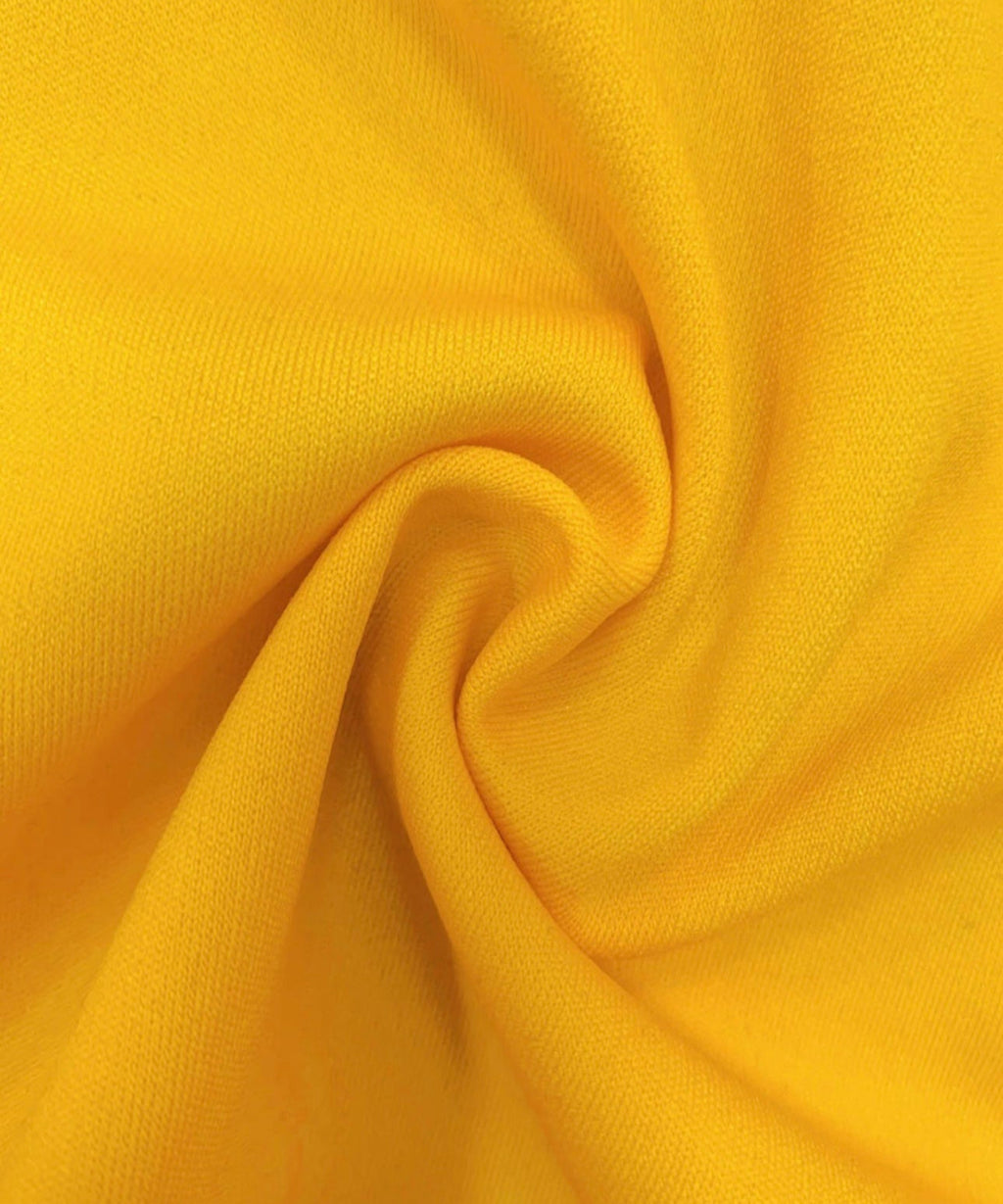 Close-up of yellow fabric with folds