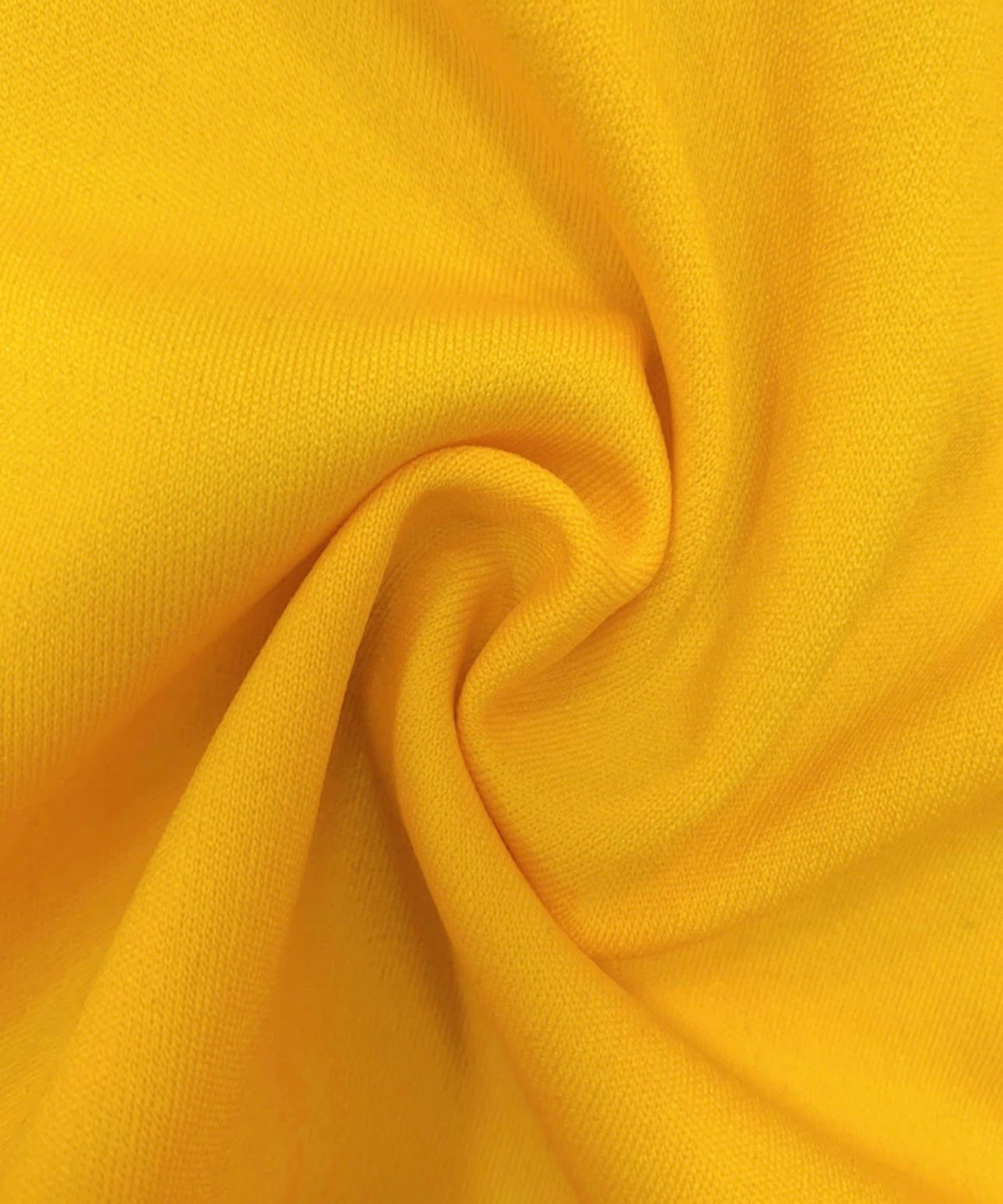Close-up of yellow fabric with folds