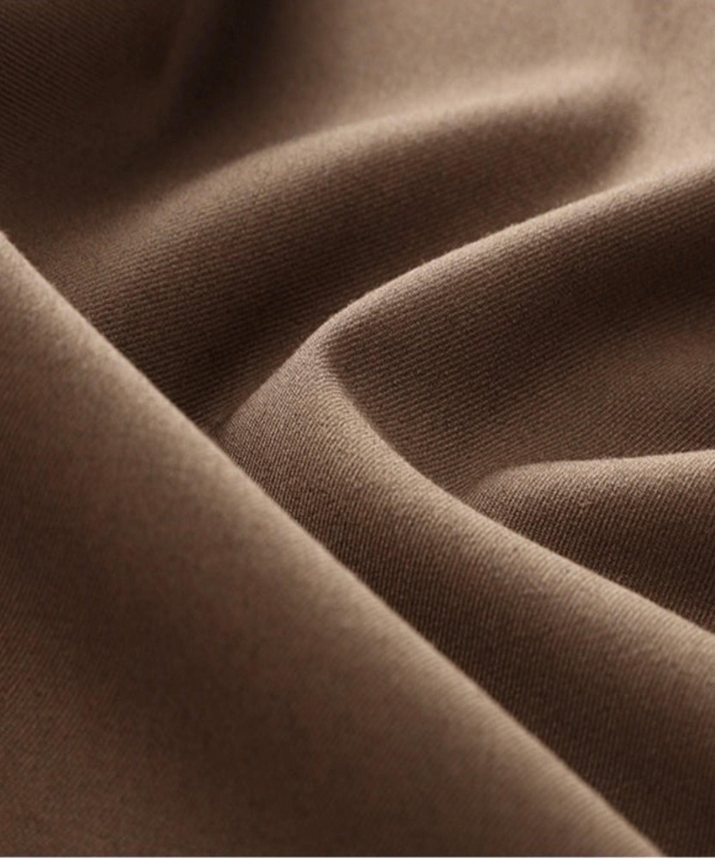 Close-up of brown fabric with folds