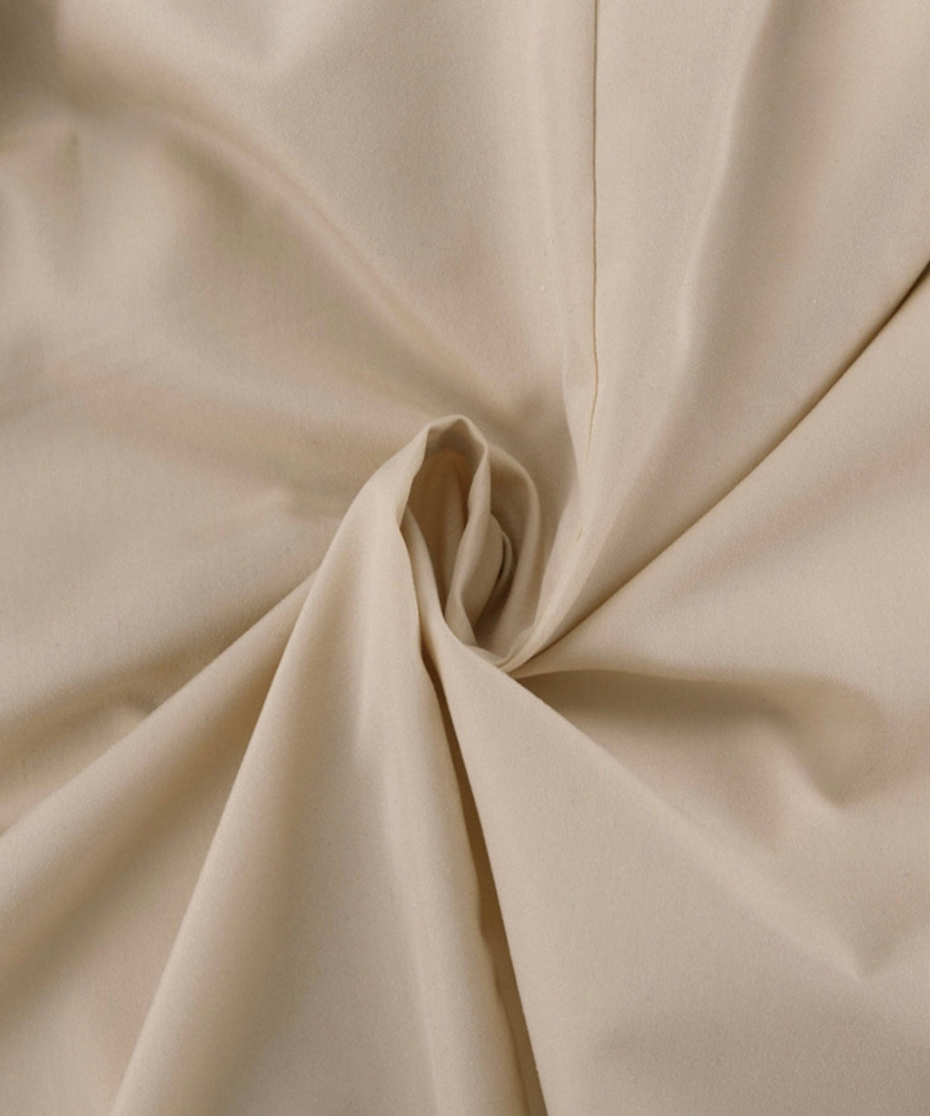 Close-up of beige fabric with folds