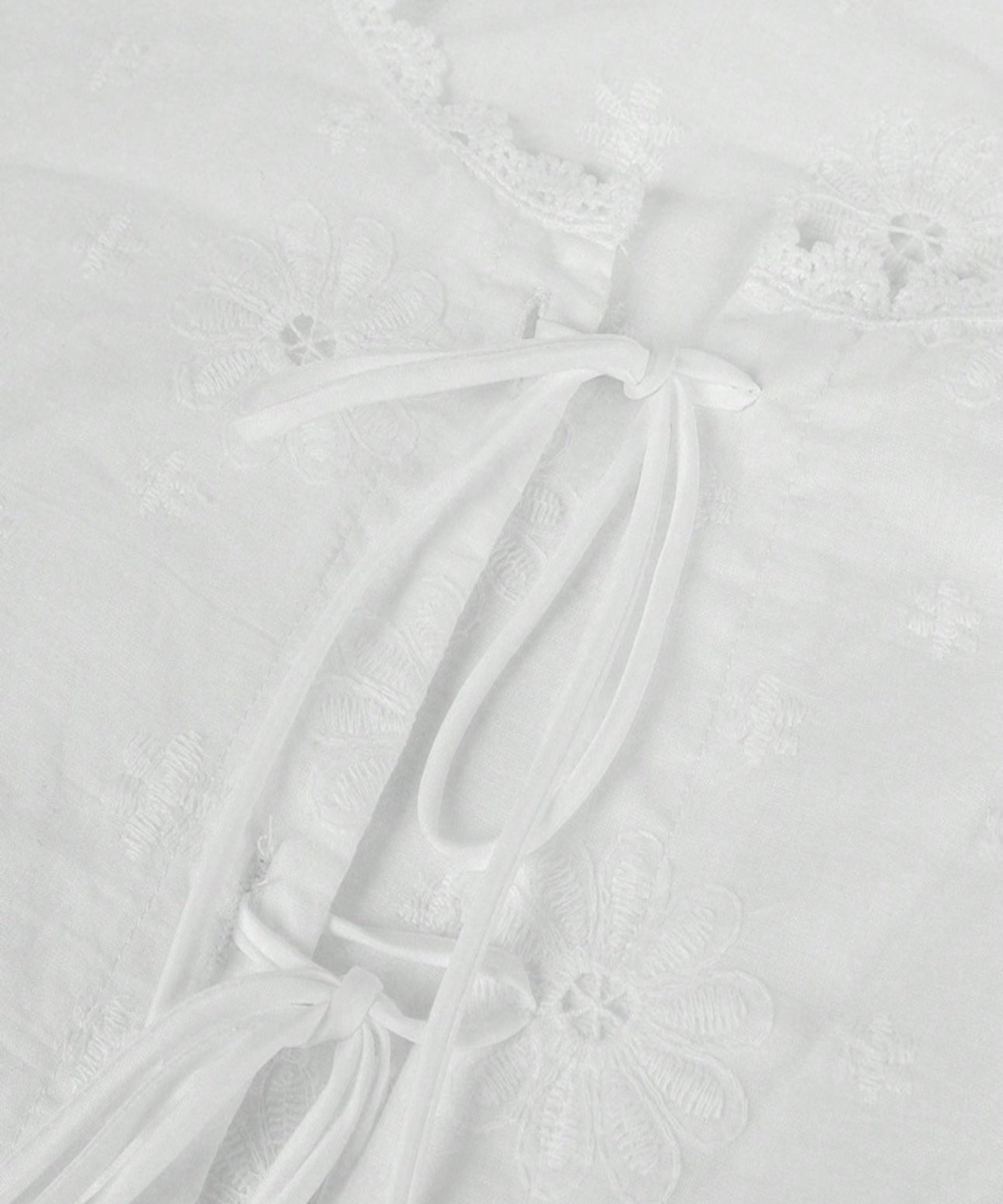 Close-up of a textured white surface with subtle patterns