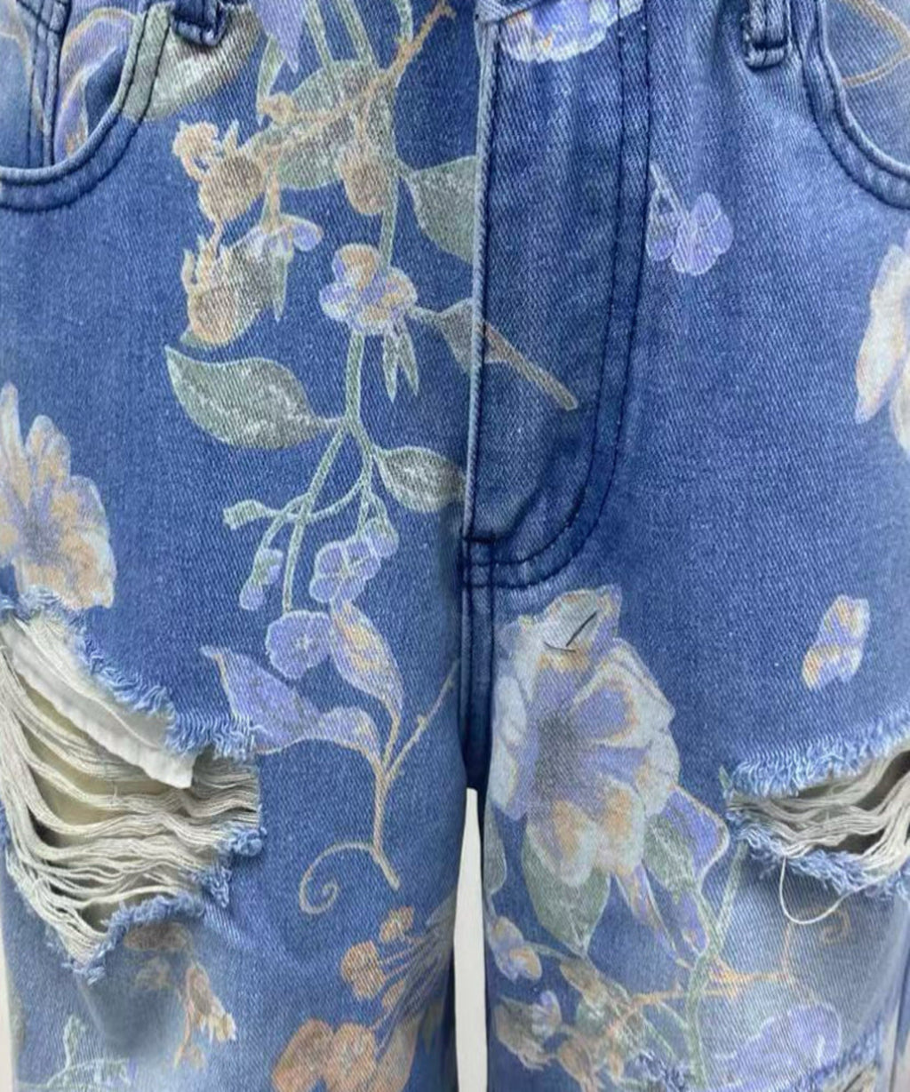 Blue jeans with floral pattern and distressed details