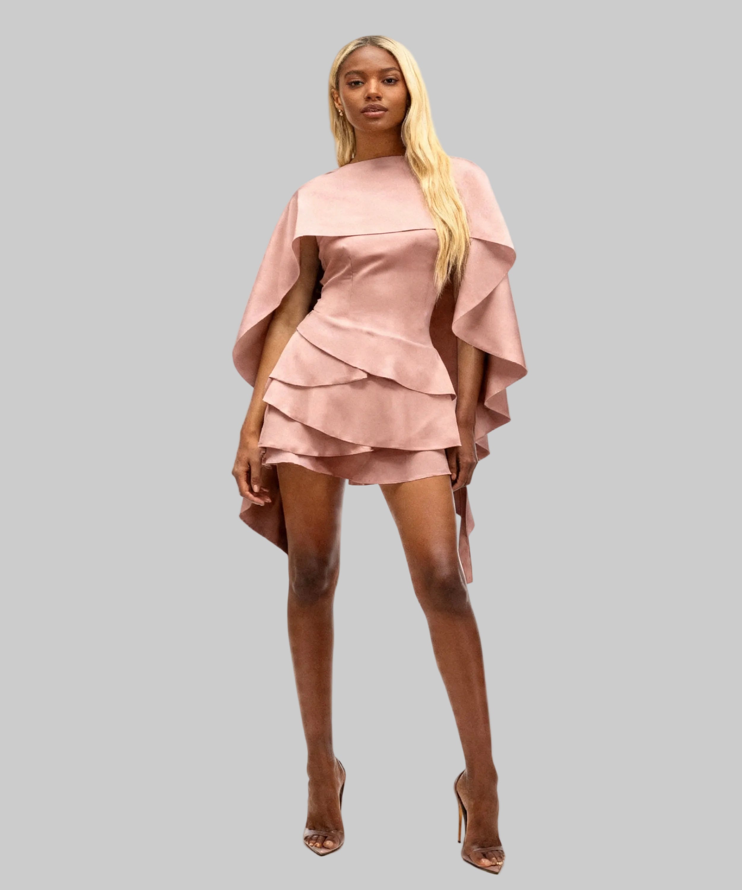 African women wearing a light pink dress on a white background
