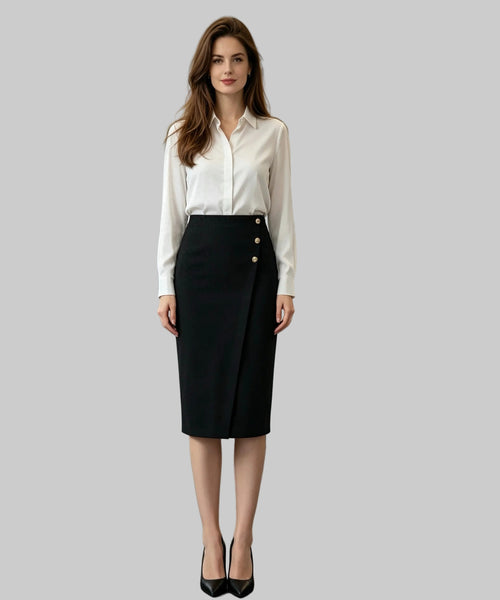 Woman in a white background setting wearing a white blouse and black skirt.