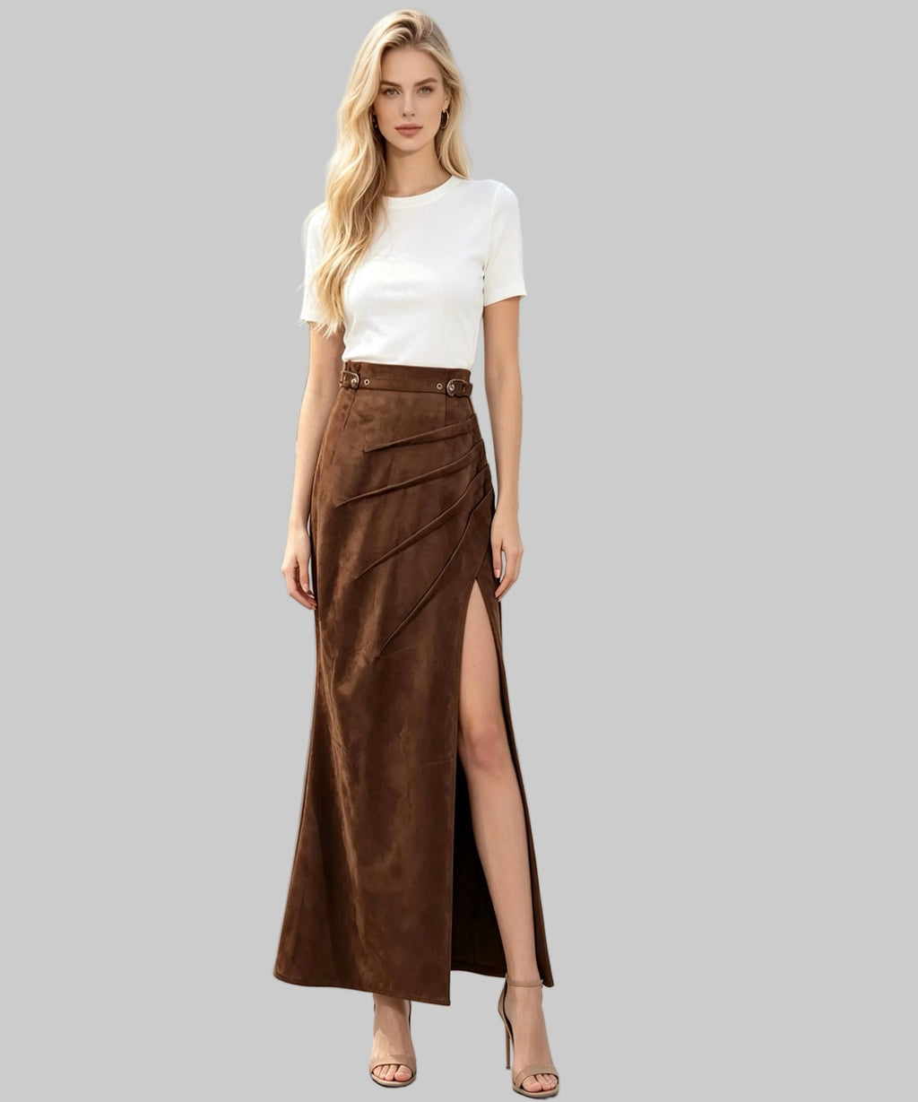 Women dressed with top and long skirt sits on a white background