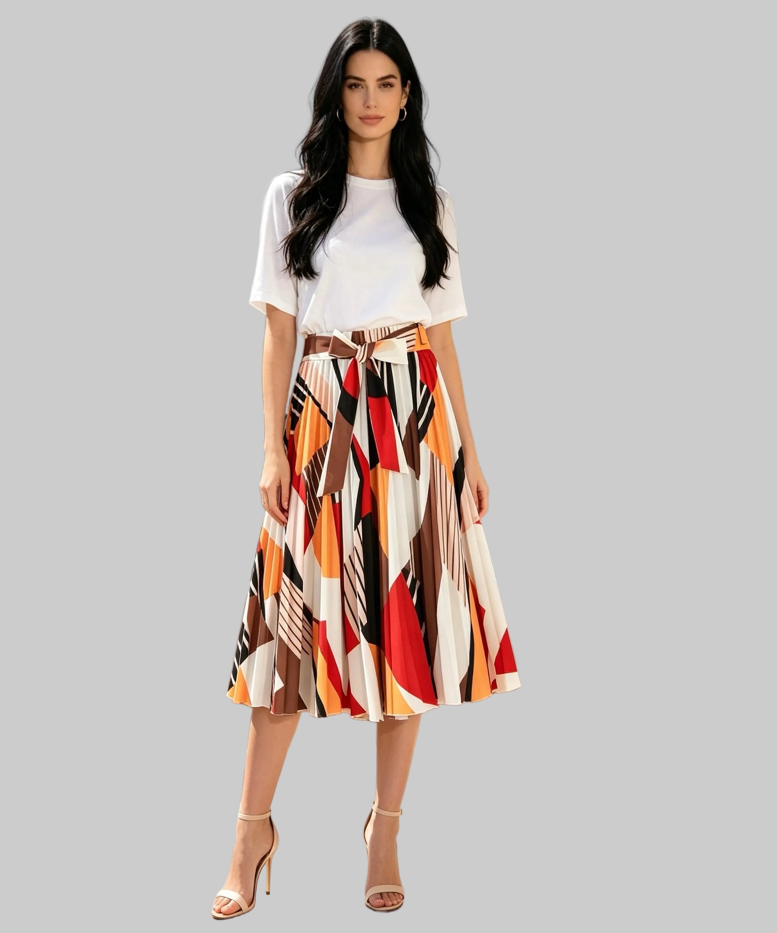 Woman in a colorful skirt and white top standing on a white background