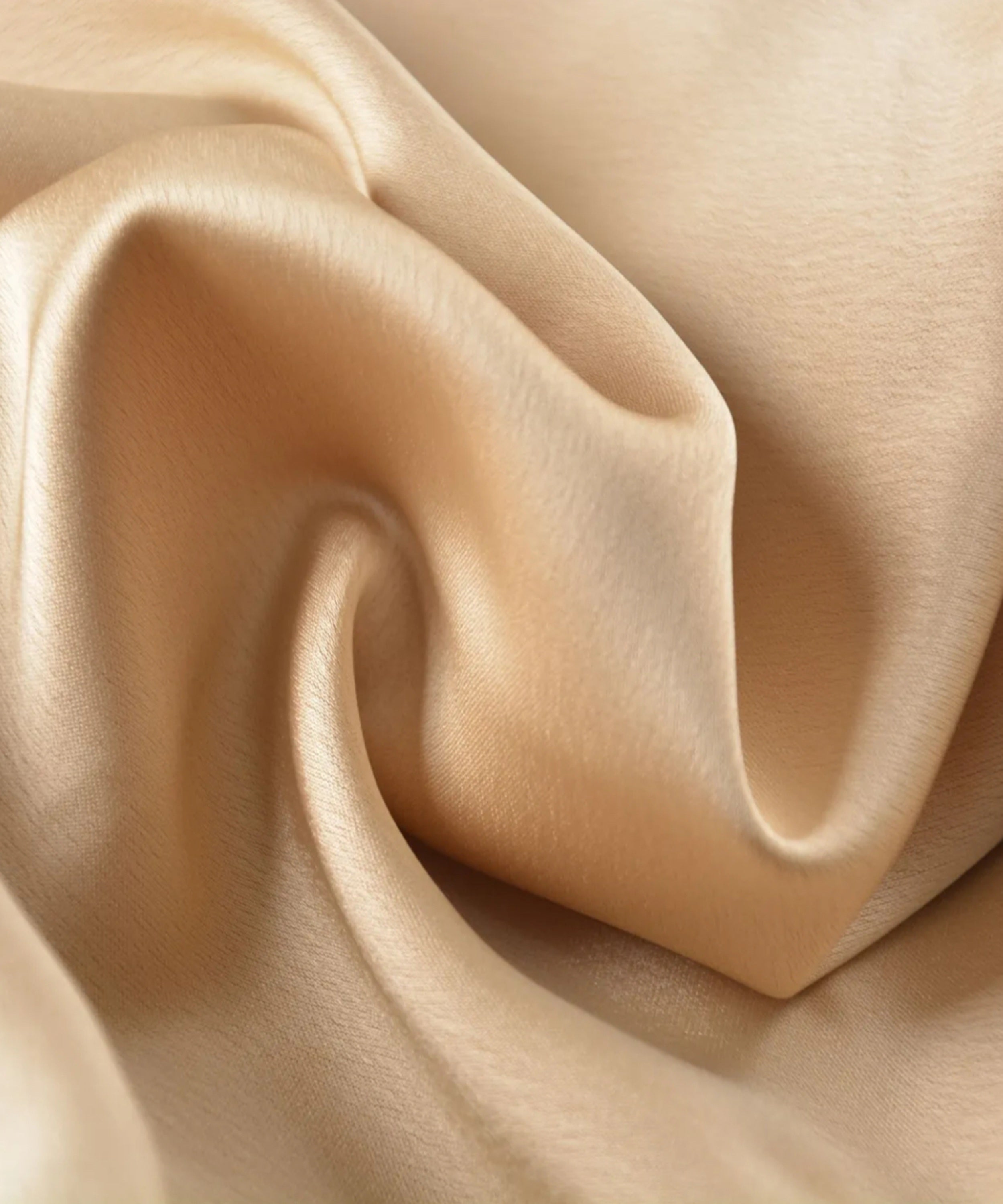 Close-up of beige fabric with folds