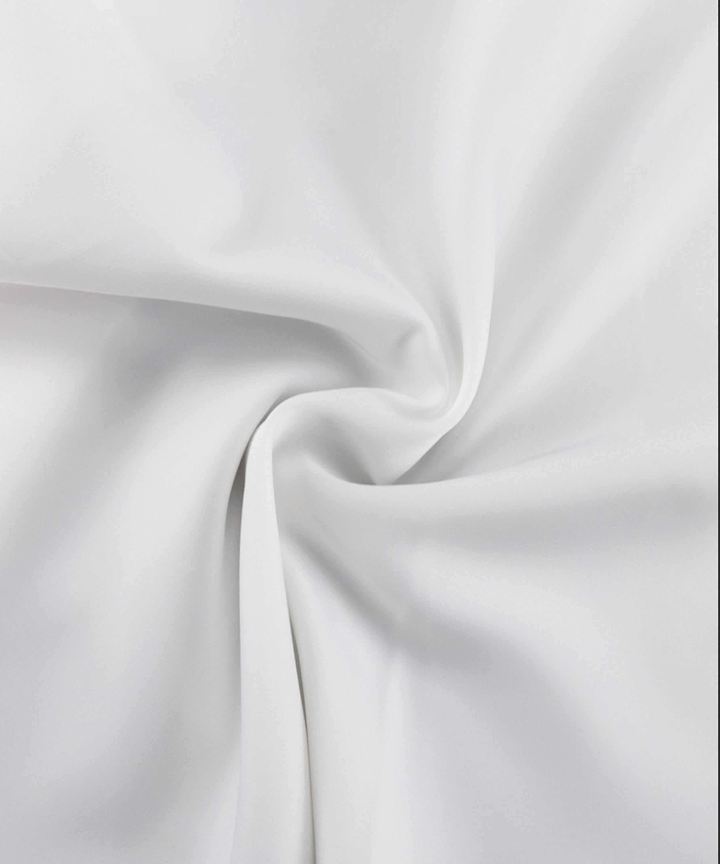 Close-up of white fabric with folds